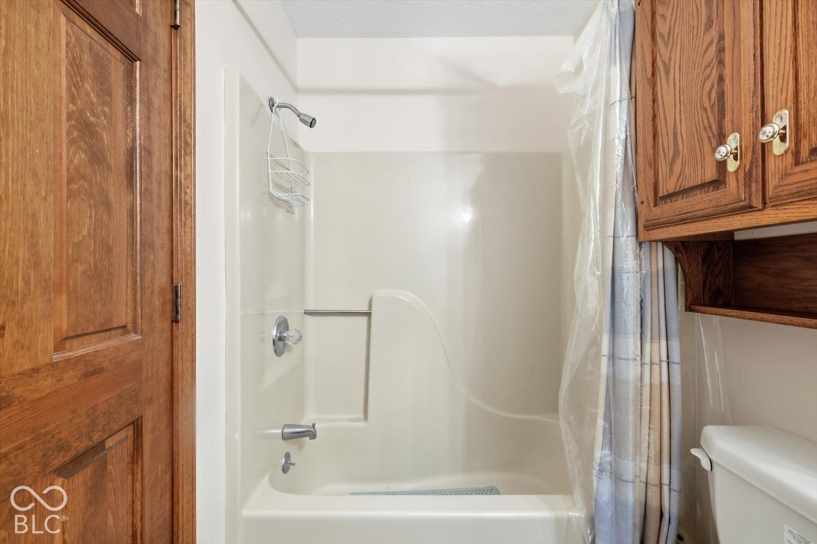 Primary Bathroom with full tub/shower unit.