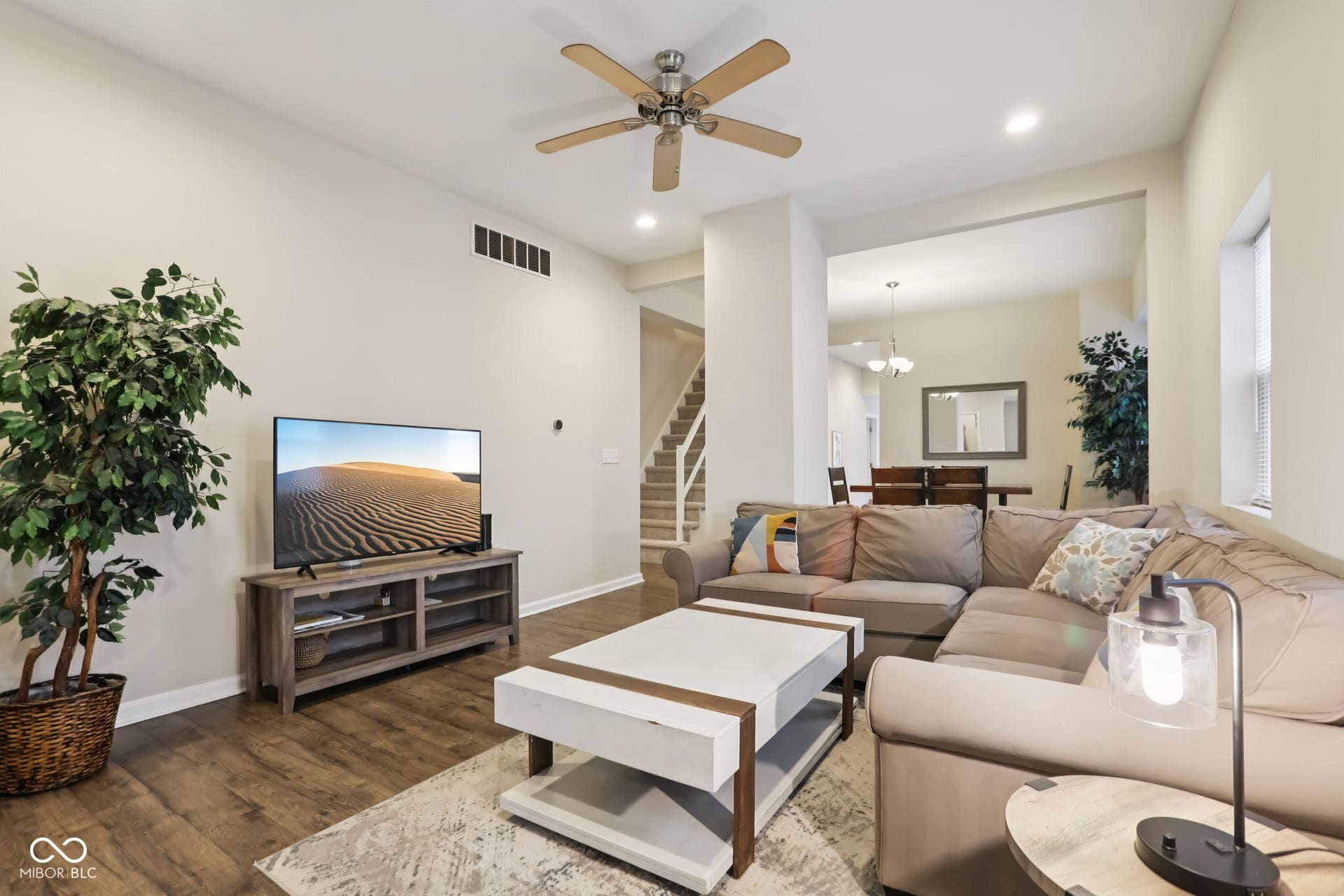 729 E Morris Street, Indianapolis, IN 46203 living room with ceiling fan, dark wood-type flooring, and suspended lighting