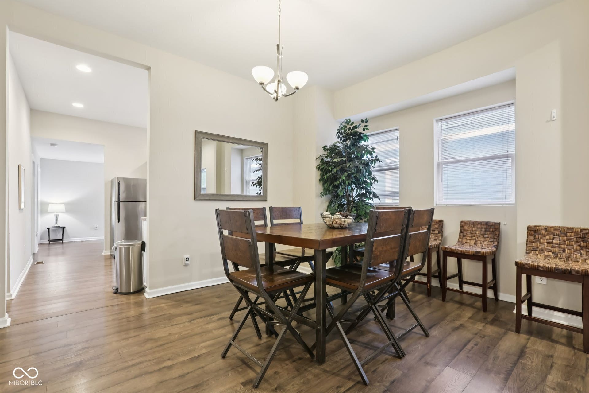 729 E Morris Street, Indianapolis, IN 46203 dining area with dark wood-style floors and a chandelier