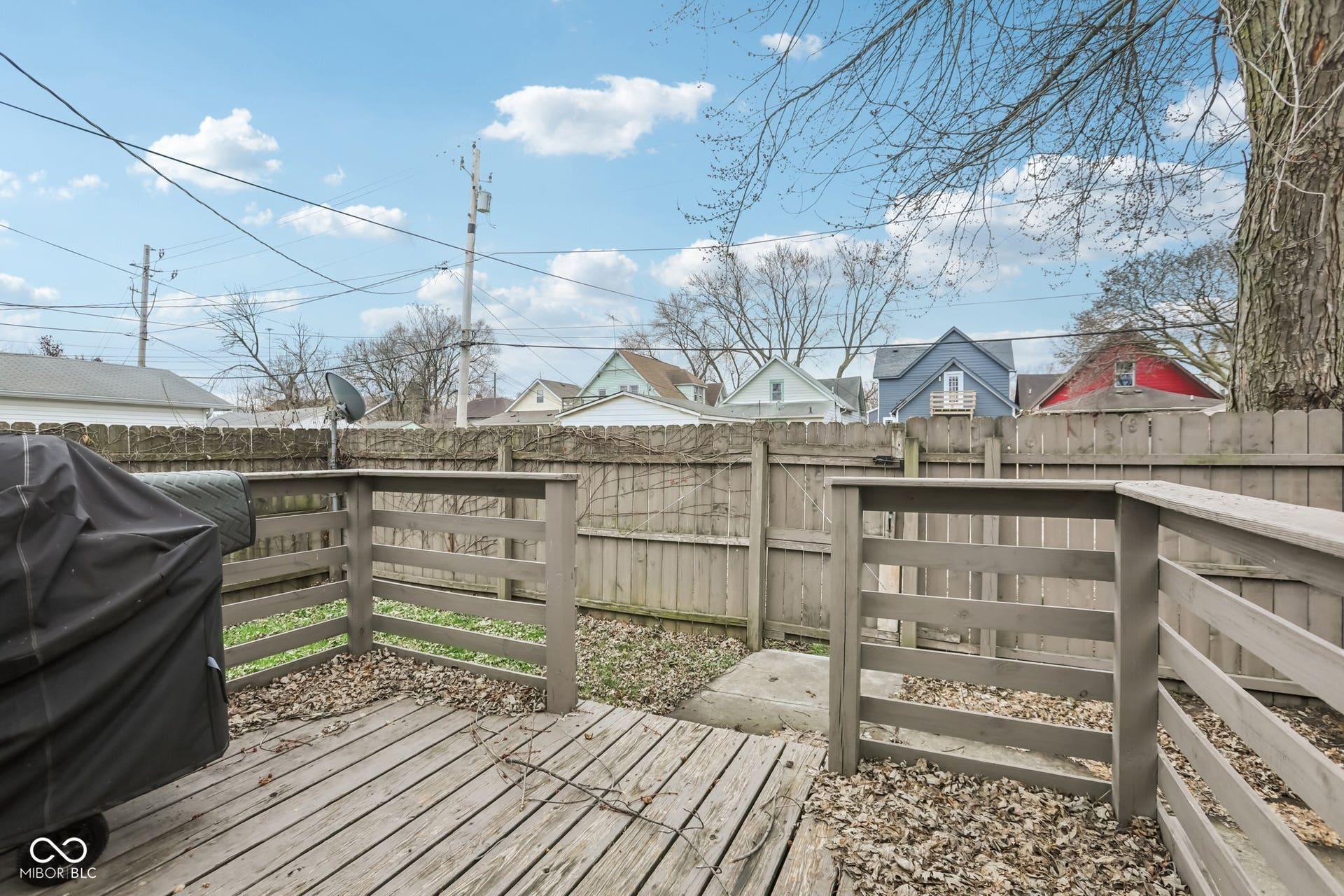 729 E Morris Street, Indianapolis, IN 46203 deck featuring a fenced backyard, area for grilling, and a residential view