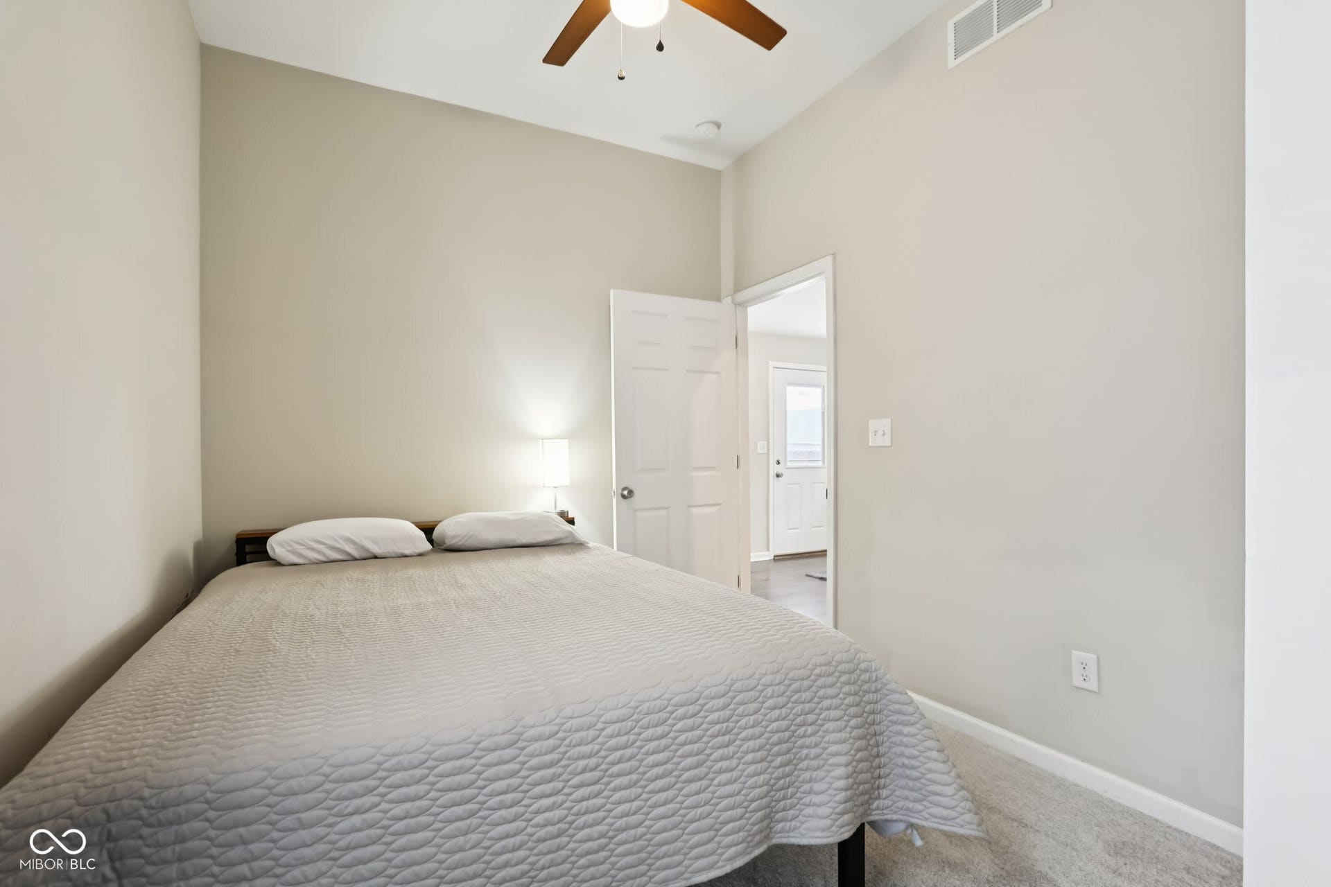 729 E Morris Street, Indianapolis, IN 46203 bedroom with carpet floors and ceiling fan