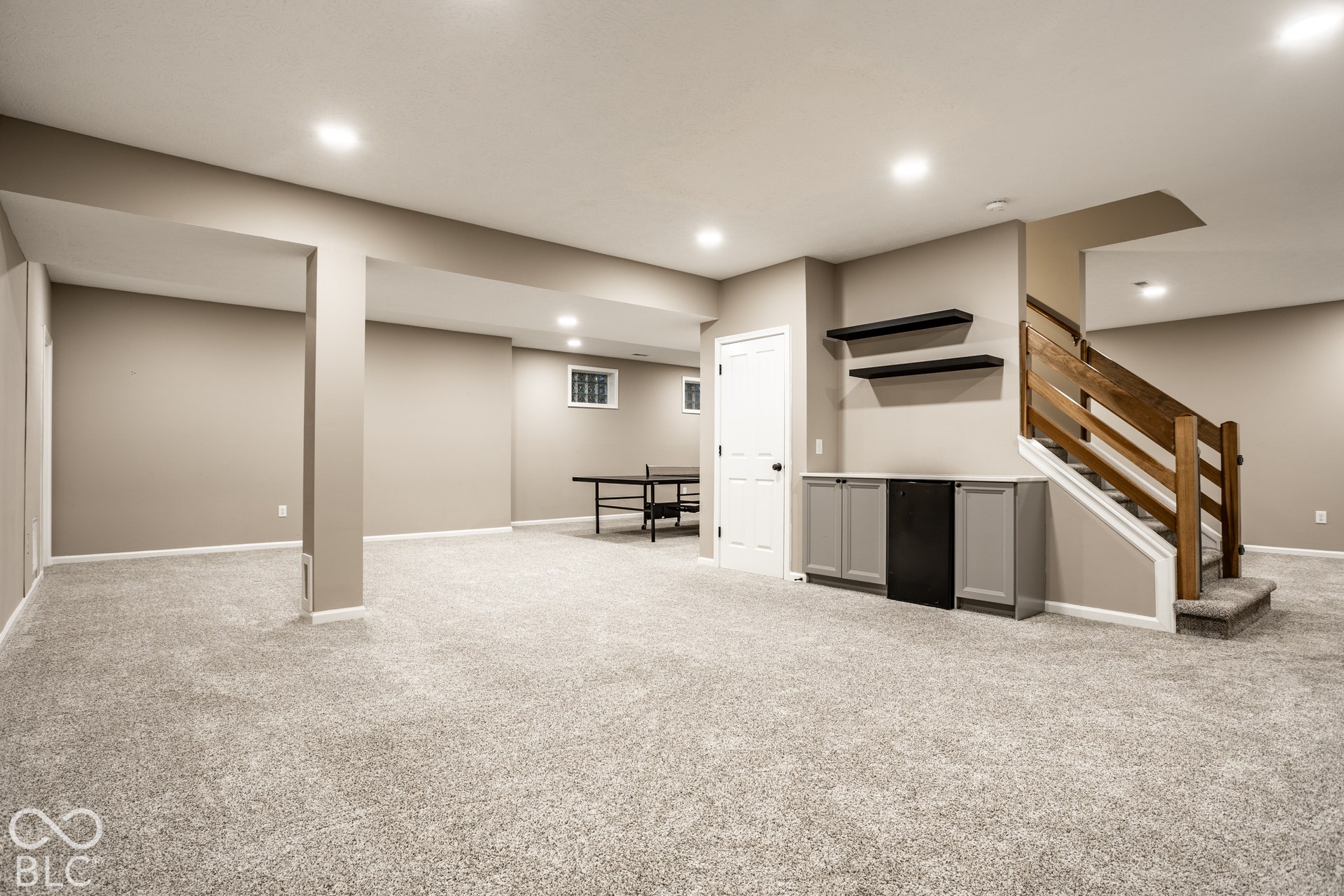 Expansive carpeted floor with recessed lighting