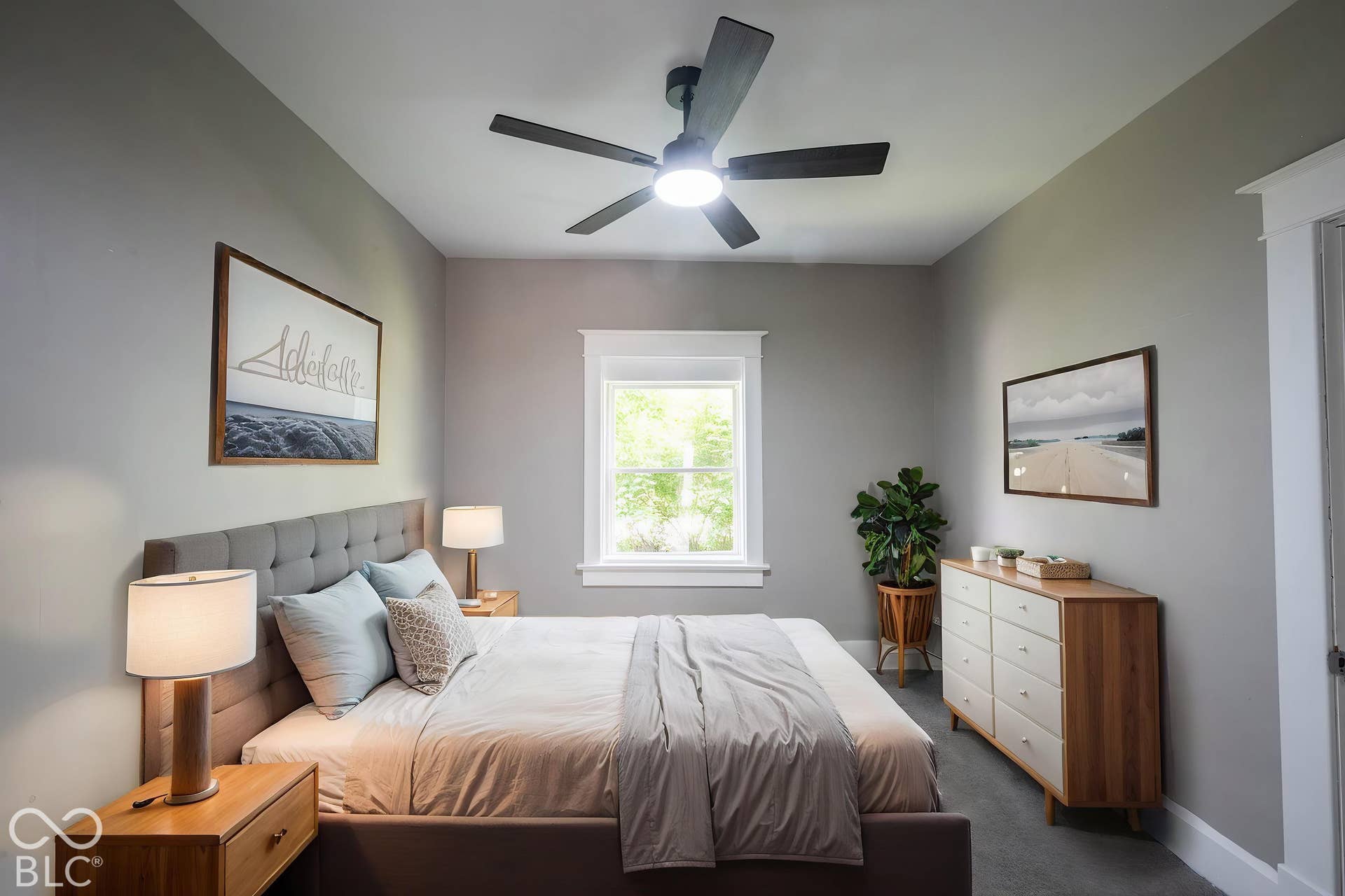 Spacious room with gray wall paint, a modern ceiling fan with integrated lighting, and a single pane window with white trim