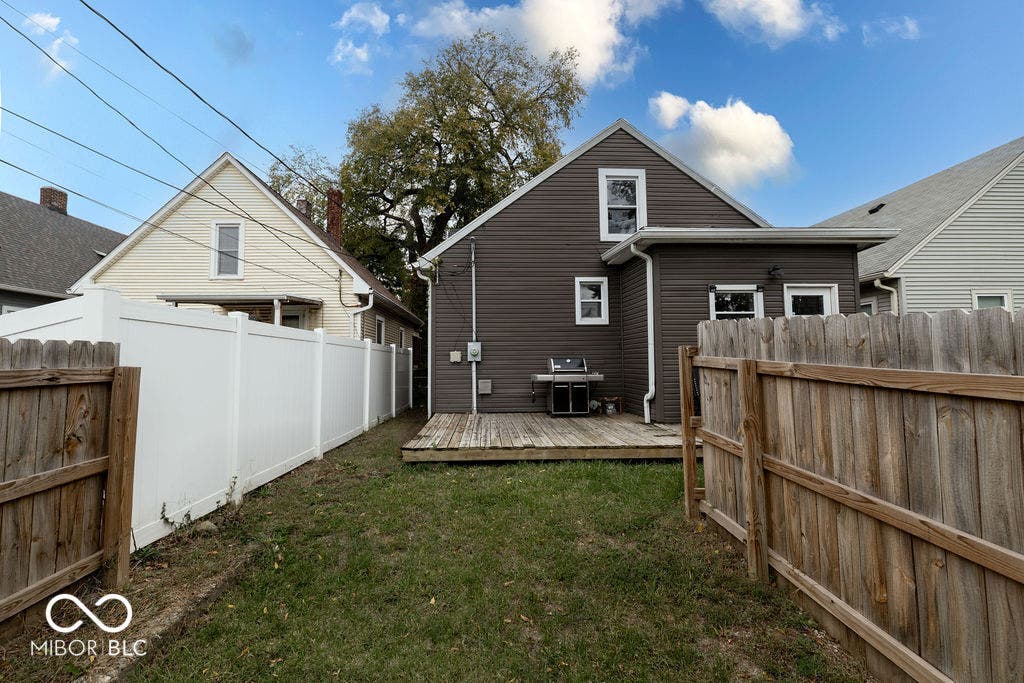 601 Cottage Avenue, Indianapolis, IN 46203 rear view of property with a fenced backyard and a deck