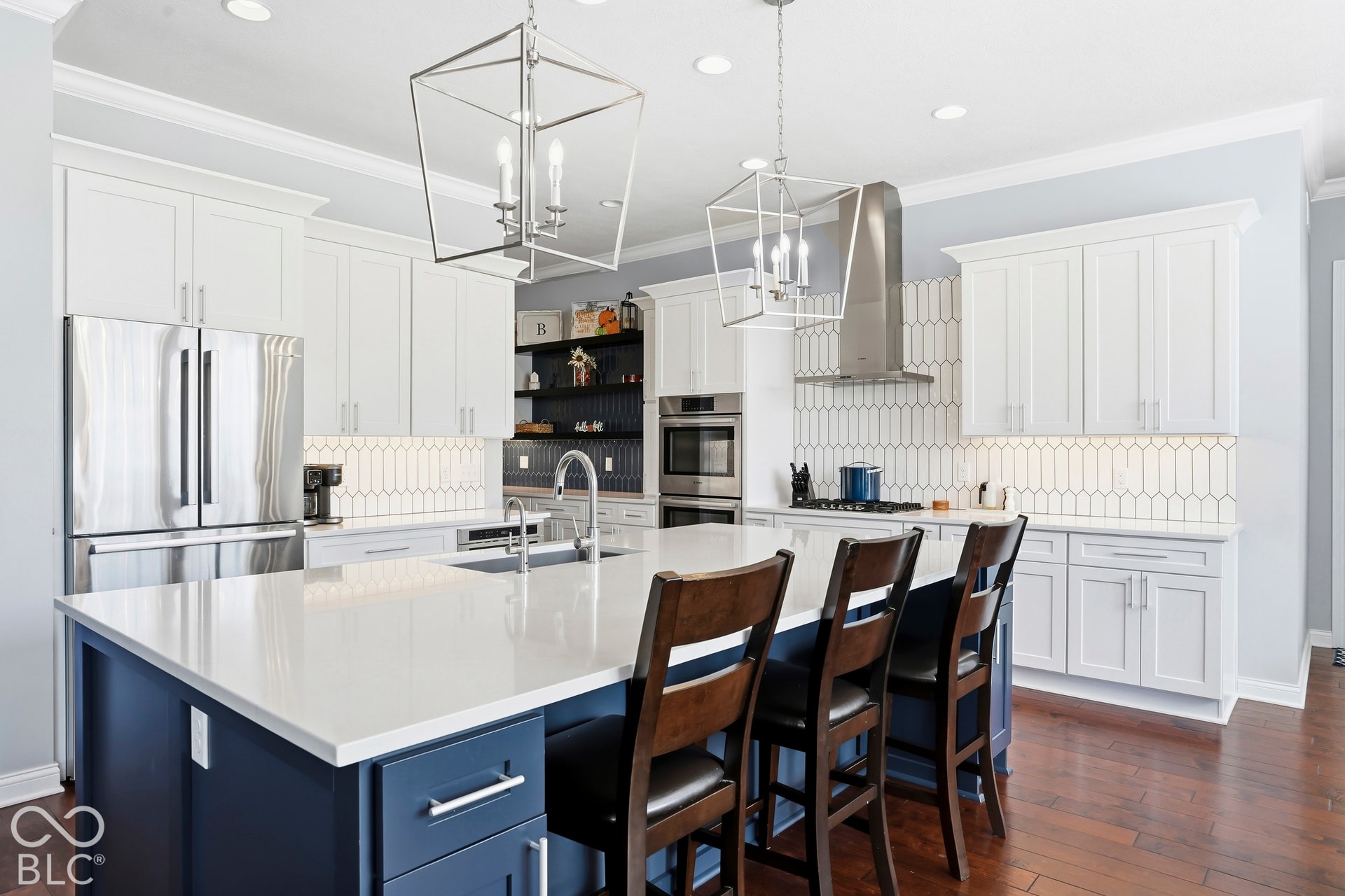Completely updated kitchen with custom cabinets, quartz countertops, walk in pantry and luxury appliances.