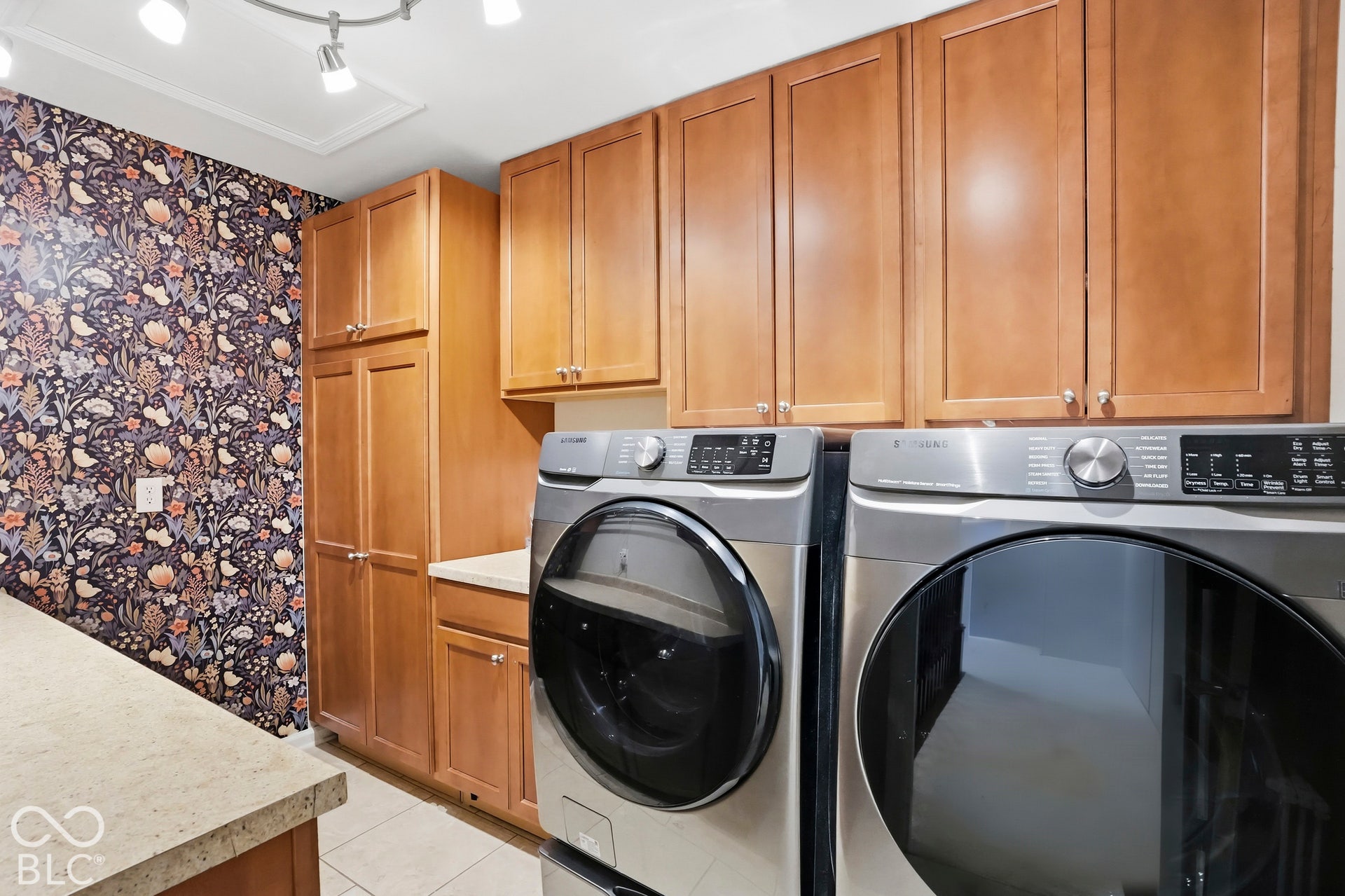 Laundry Upper Level for convenience with cabinets and countertops