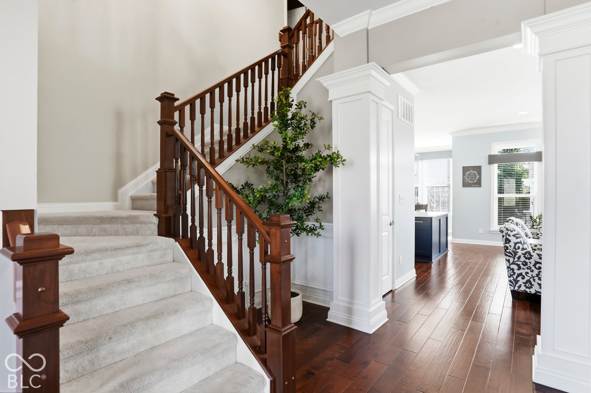 Beautiful Entry with hardwoods and wood architectural details