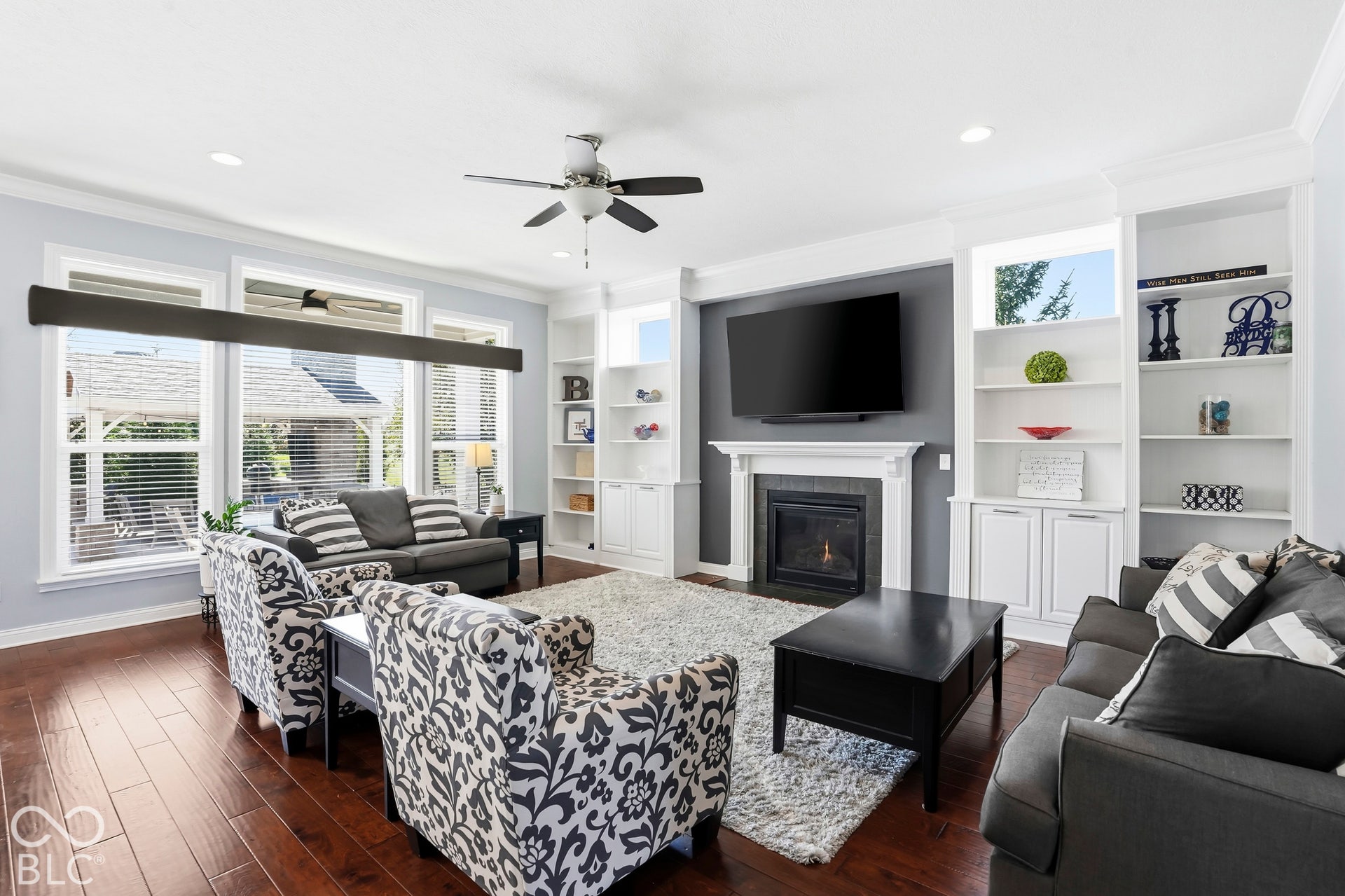 Family Room with custom built ins, gas fireplace and hardwood floors.