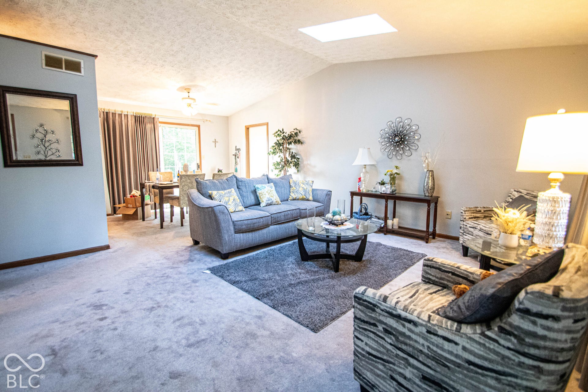 Vaulted ceiling with a skylight, providing ample natural light