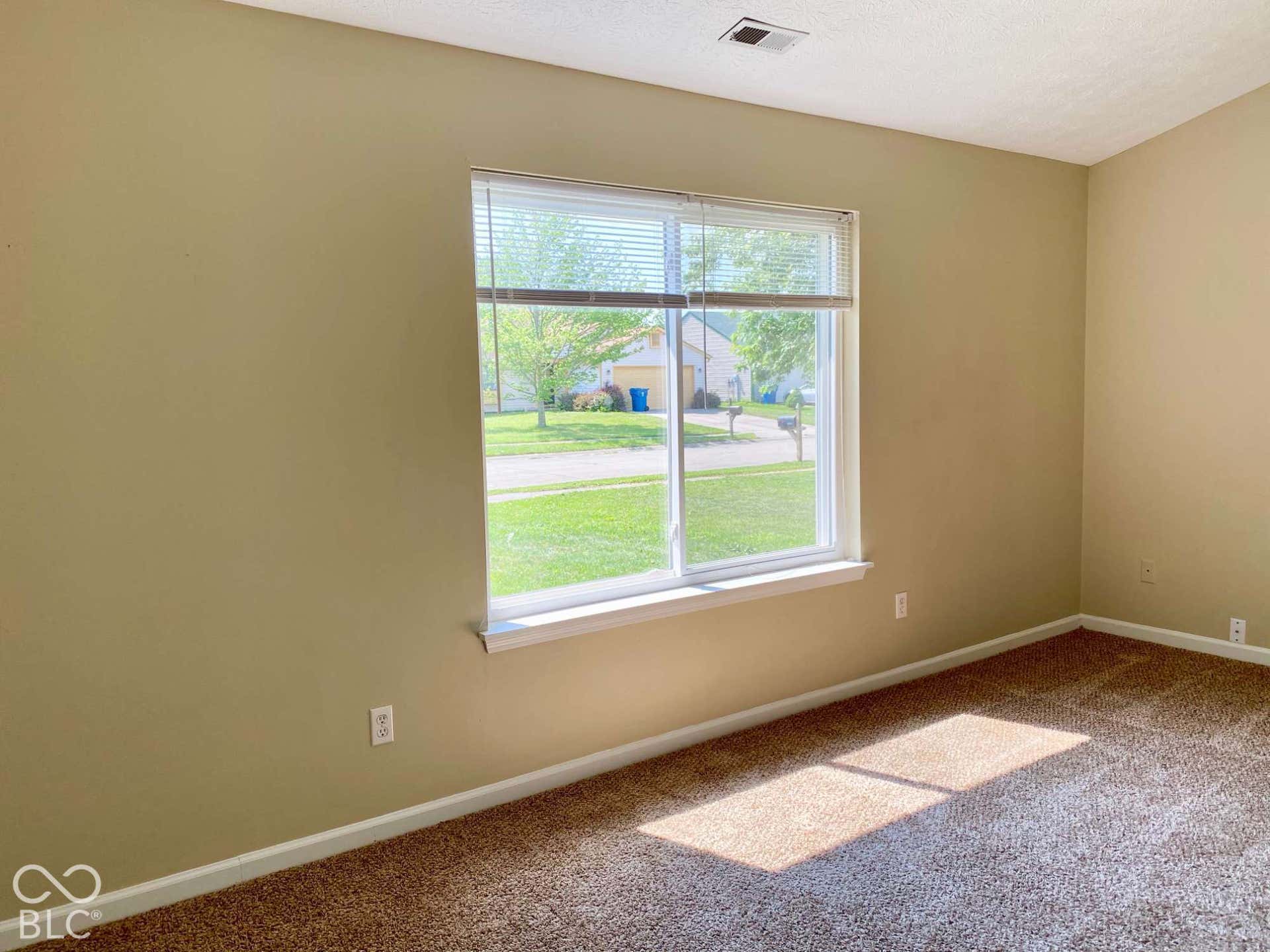 3911 Bonn Drive, Indianapolis, IN 46228 Wall-to-wall carpeting with light beige wall paint and white trim