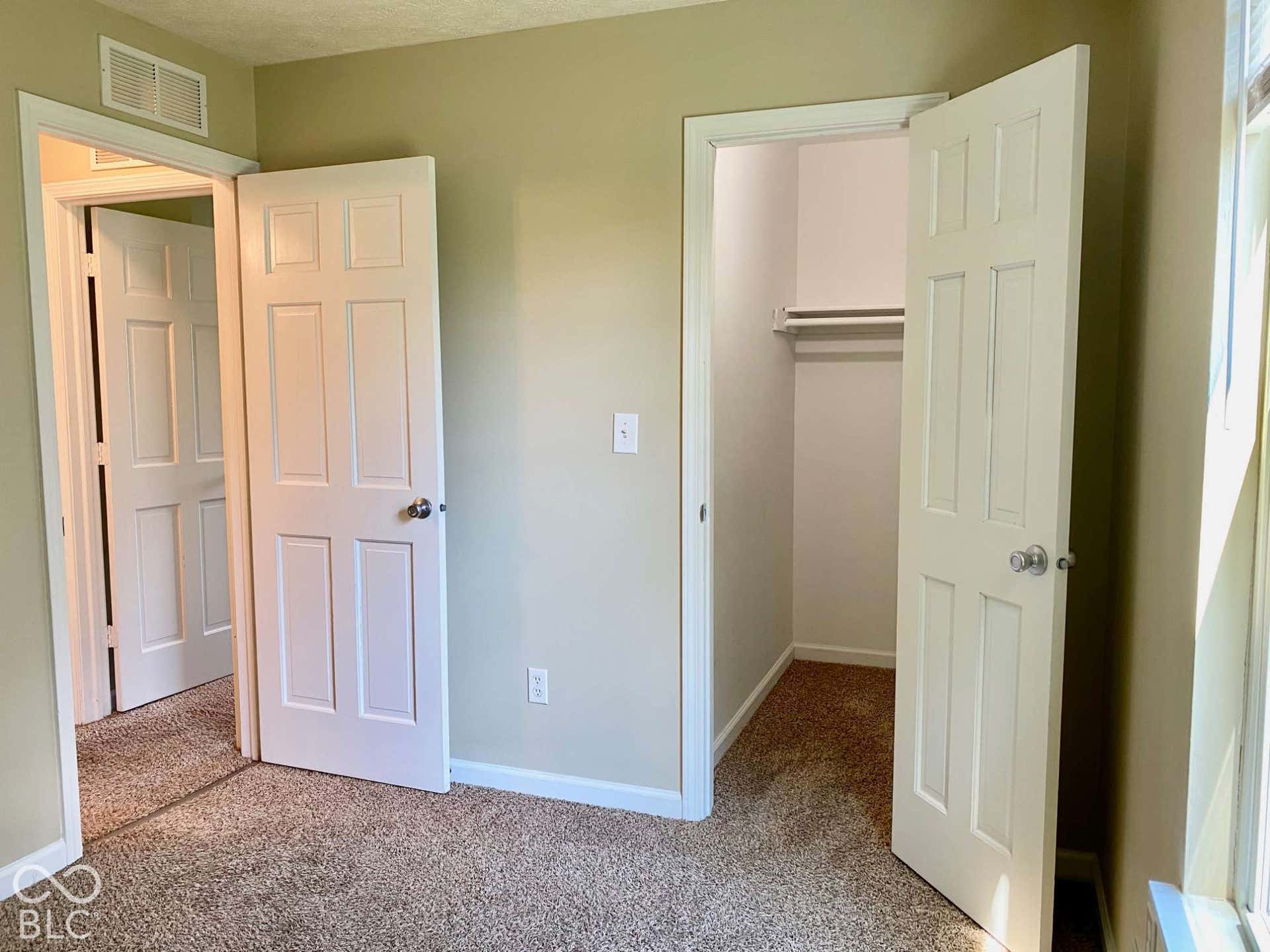 3911 Bonn Drive, Indianapolis, IN 46228 Wall-to-wall carpeting, paneled interior doors, and a built-in closet with shelving and hanging rod