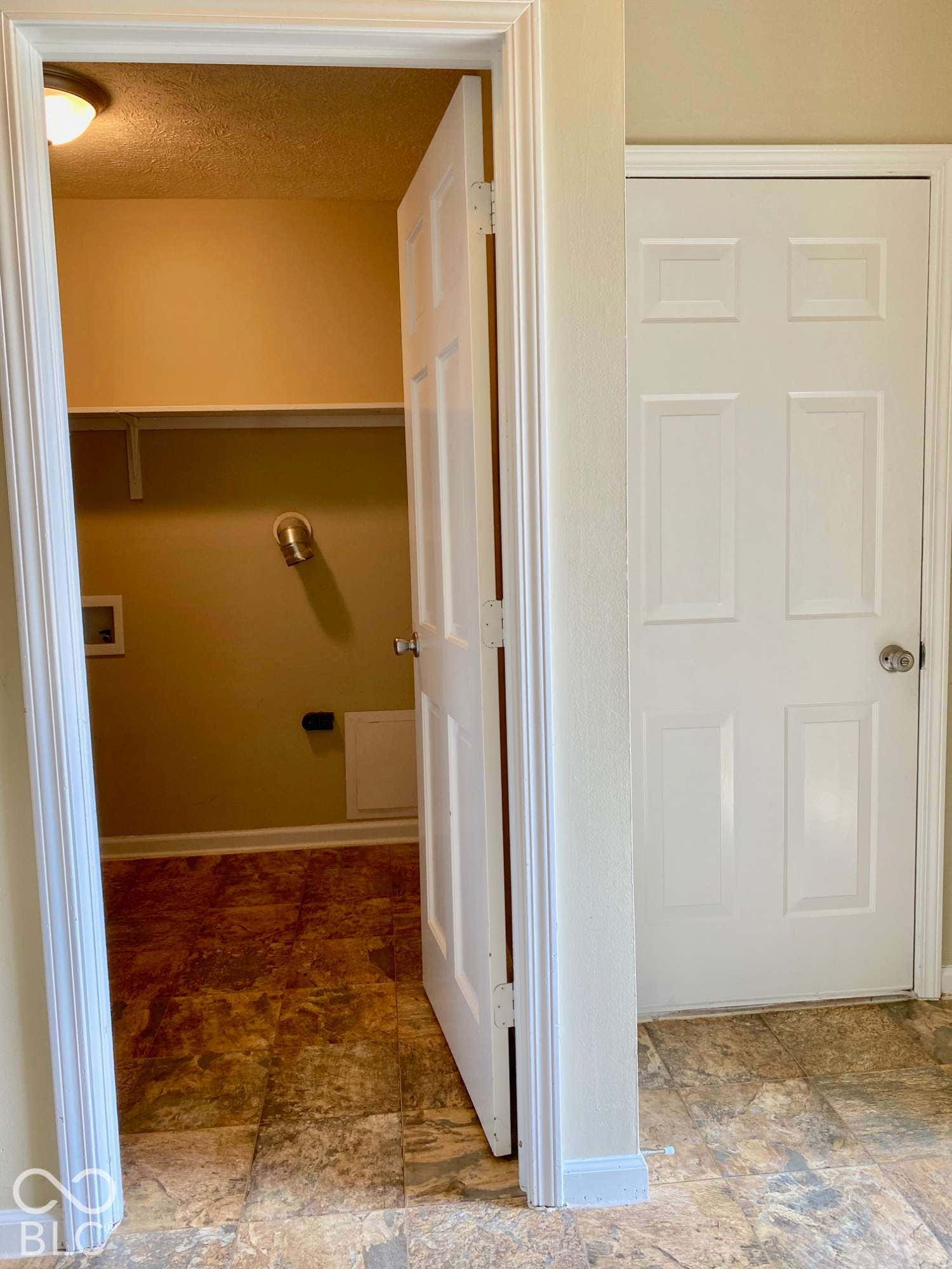 3911 Bonn Drive, Indianapolis, IN 46228 Utility area featuring vinyl flooring, a built-in shelf, and a ceiling-mounted light fixture