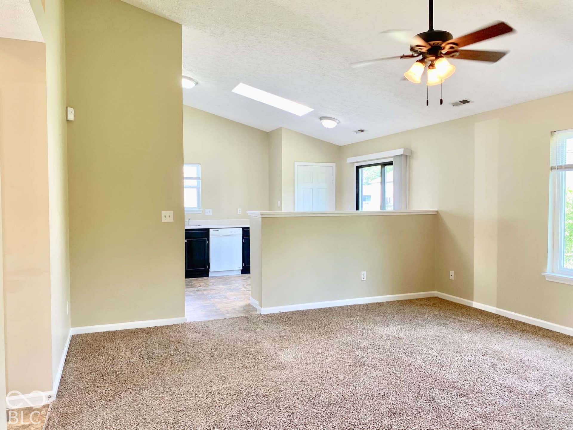 3911 Bonn Drive, Indianapolis, IN 46228 Vaulted ceilings with a ceiling fan, recessed lighting, skylight, and a sliding glass door