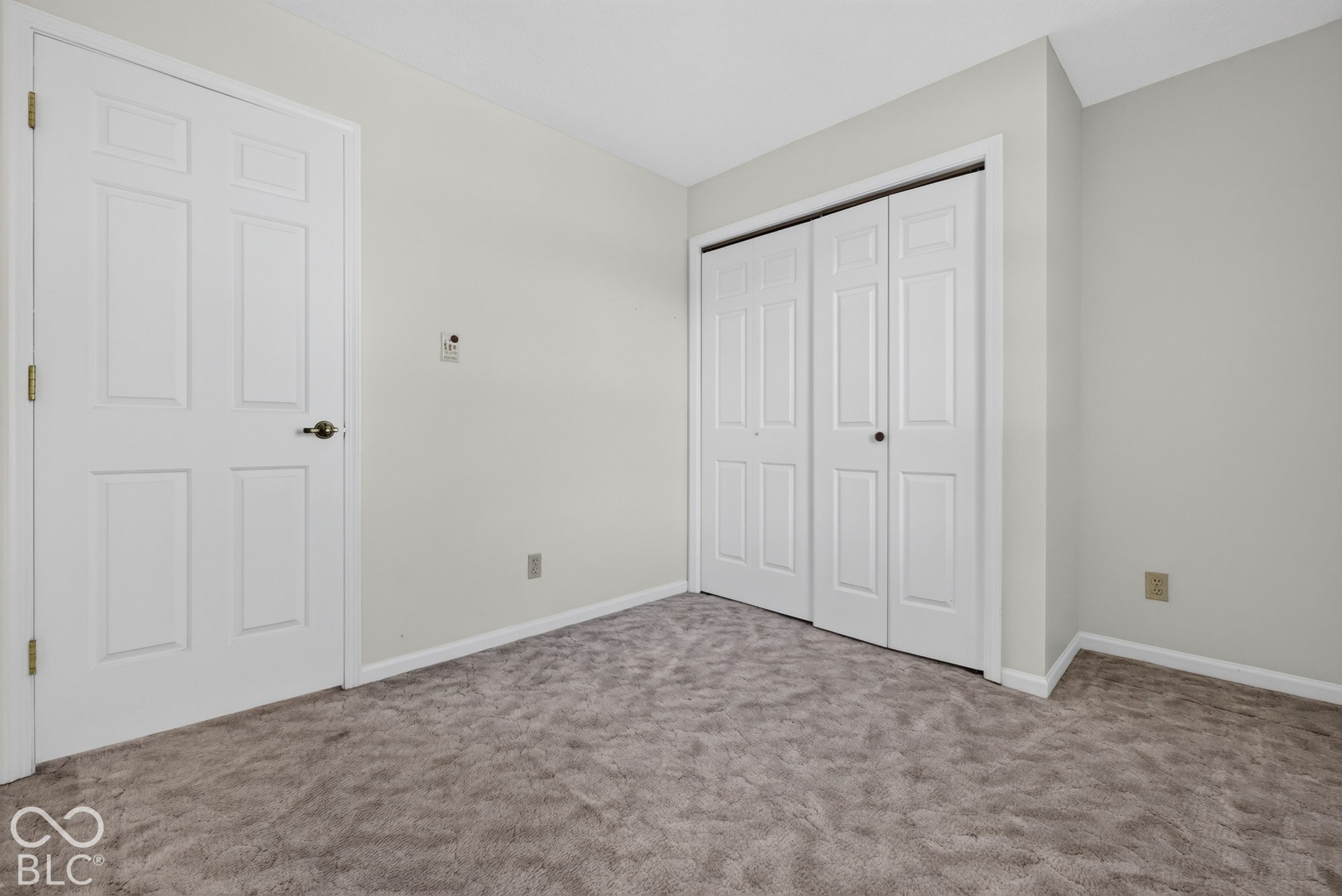Neutral wall color with white trim