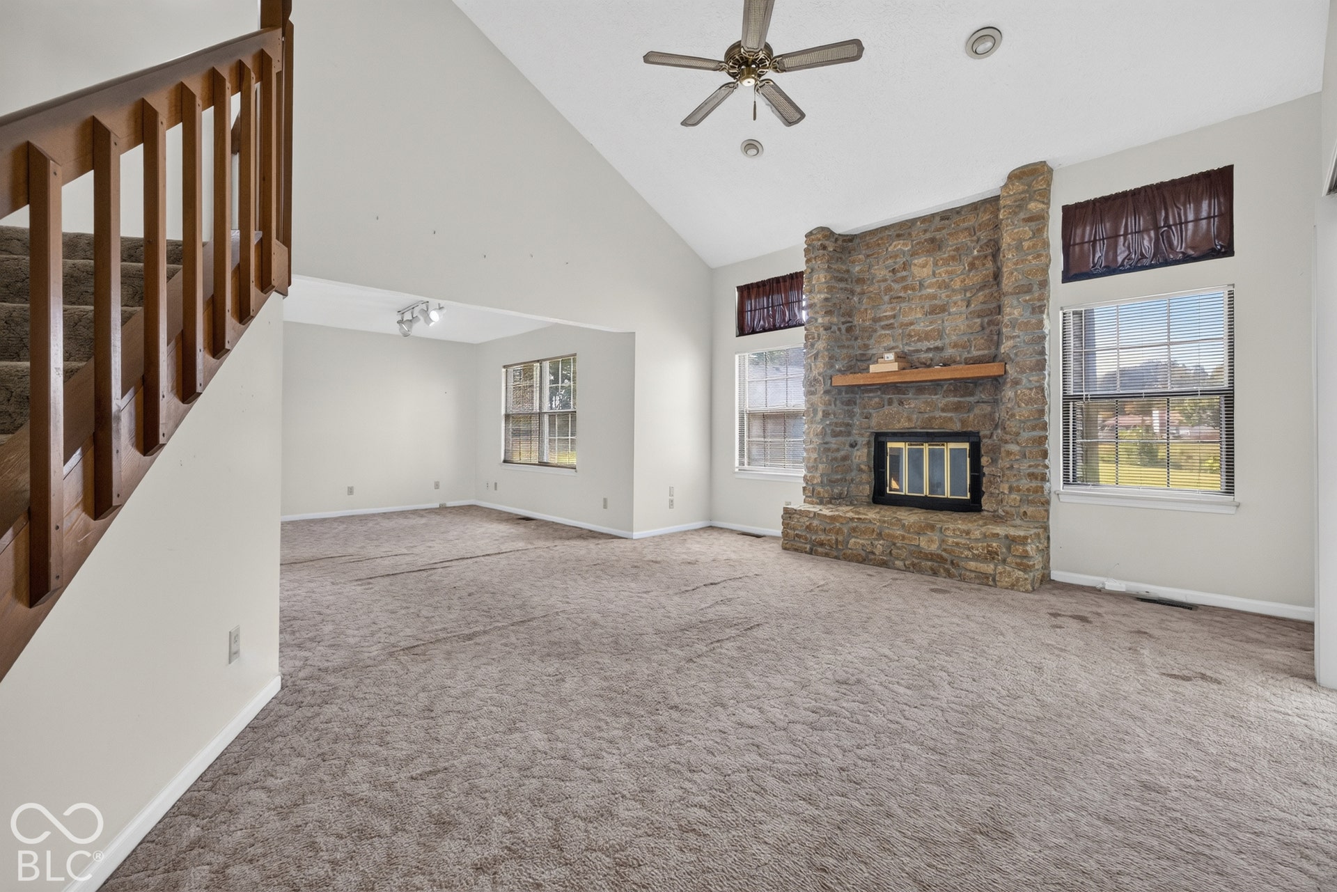 Vaulted ceiling with an overhead fan