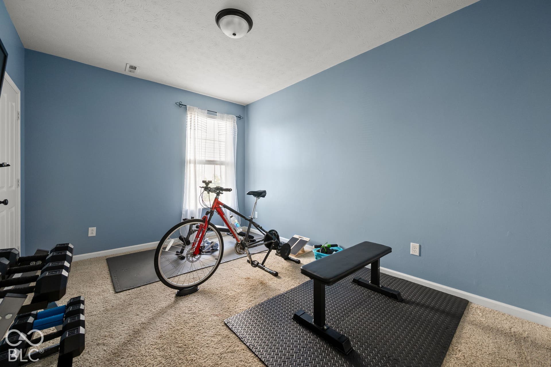 Main Floor Bedroom. Wall-to-wall carpeting with a neutral finish