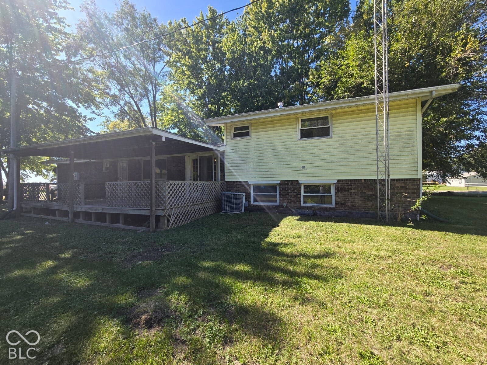 Expansive covered deck with lattice railing