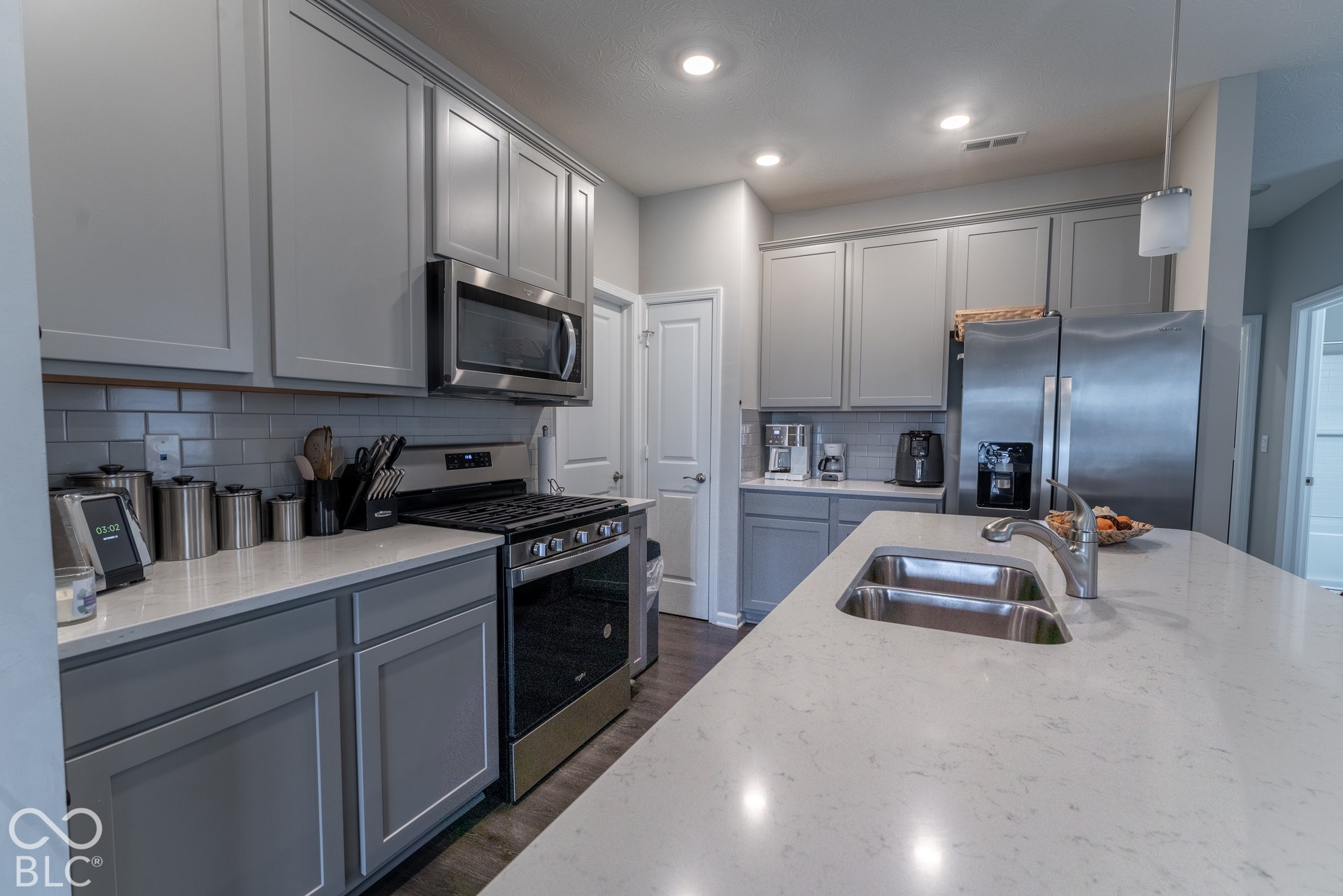 6432 Yuma, Whitestown, IN 46075 Kitchen featuring light gray cabinetry, stainless steel appliances, a subway tile backsplash, white countertops, and recessed lighting