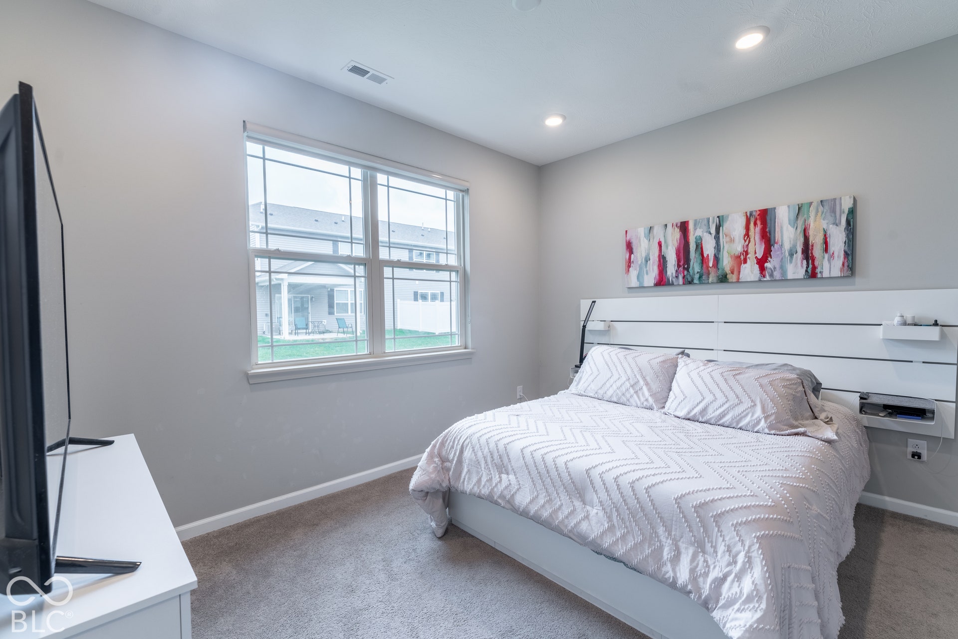 6432 Yuma, Whitestown, IN 46075 Carpeted flooring, recessed lighting, and a large window with white trim