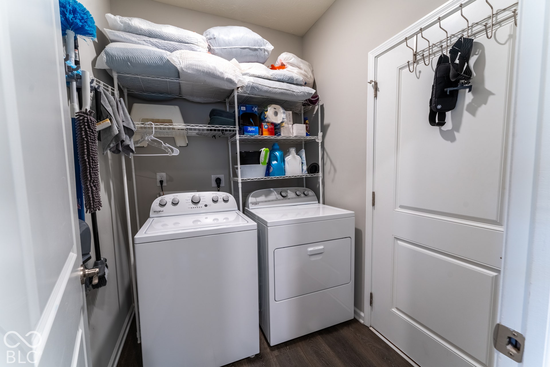 6432 Yuma, Whitestown, IN 46075 Dedicated laundry area featuring a white top-load washer, a white front-load dryer, and built-in wire shelving
