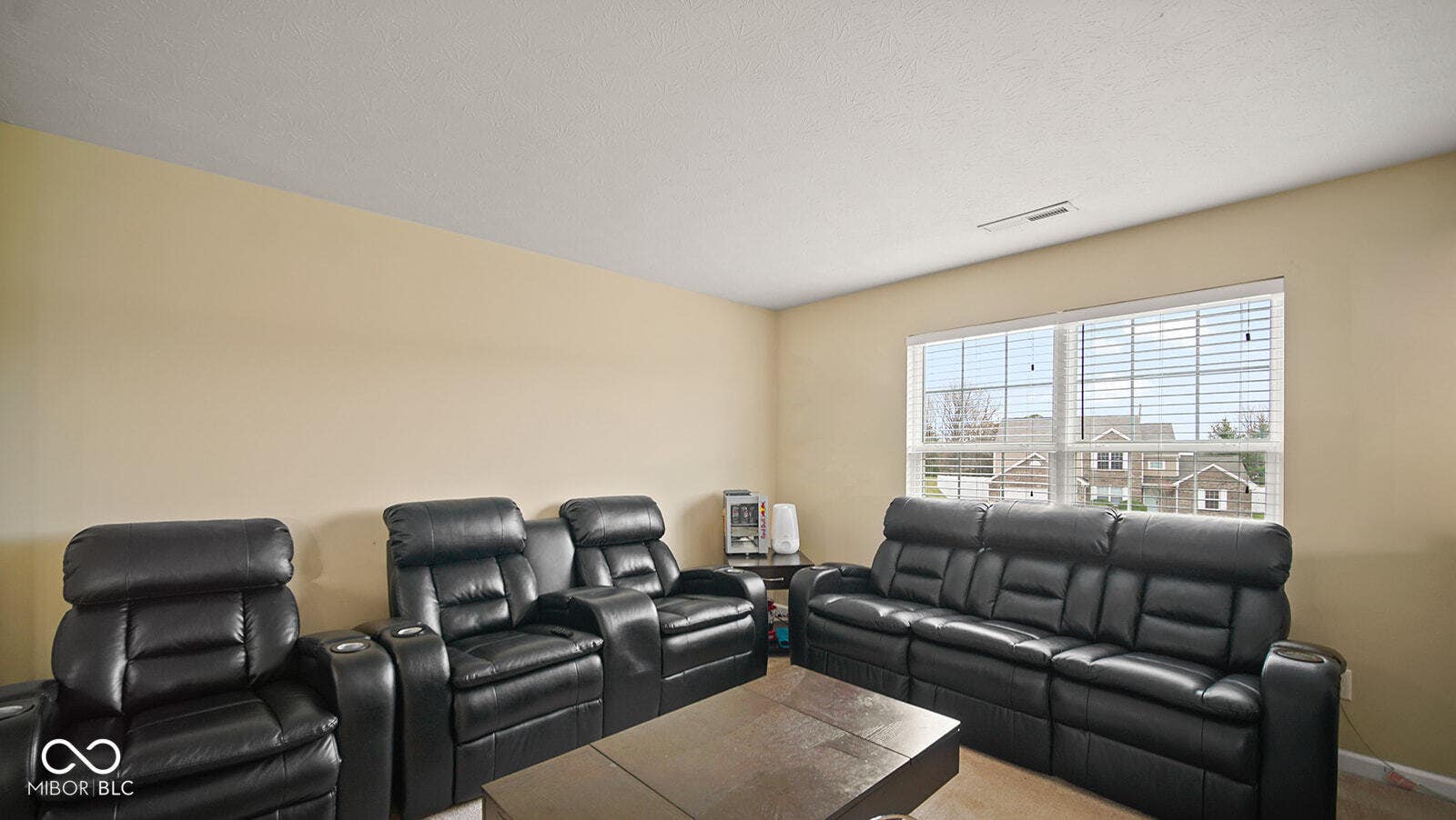 home theater room with baseboards and visible vents