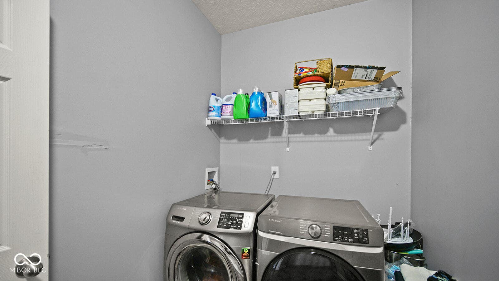 clothes washing area with washer and dryer and laundry area