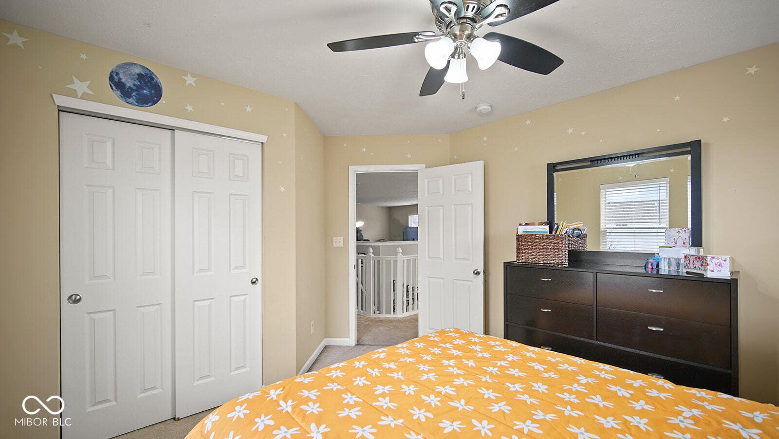 bedroom with a ceiling fan, baseboards, and a closet