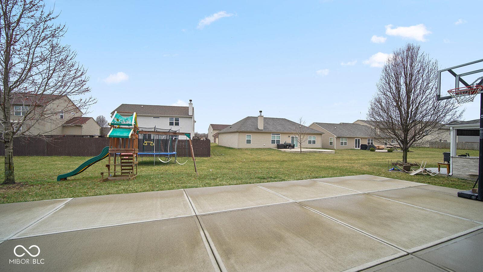 view of yard featuring fence and a playground