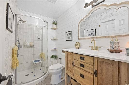 Walk-in shower with curved glass enclosure and tiled walls