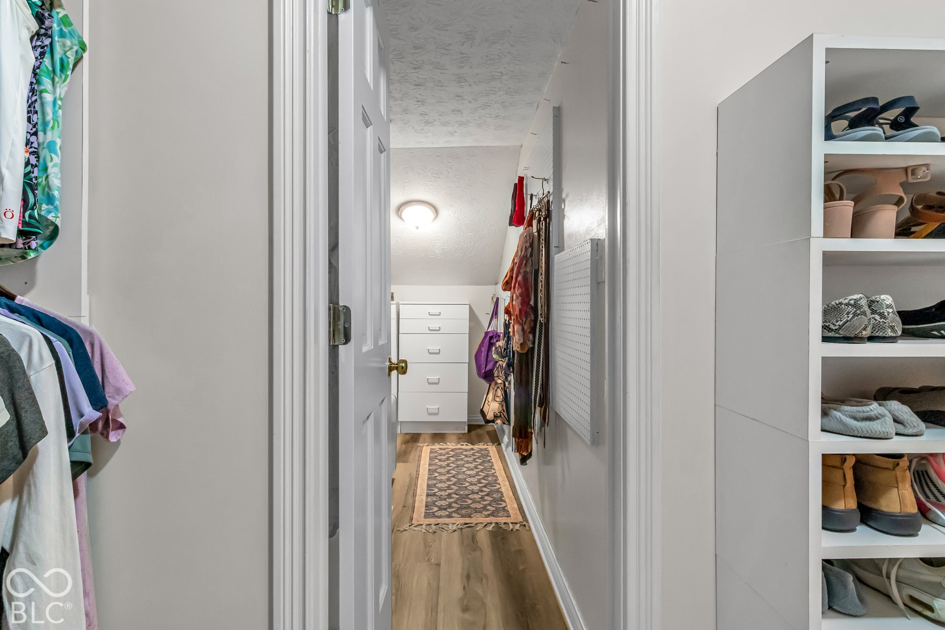 Primary bedroom closet continues