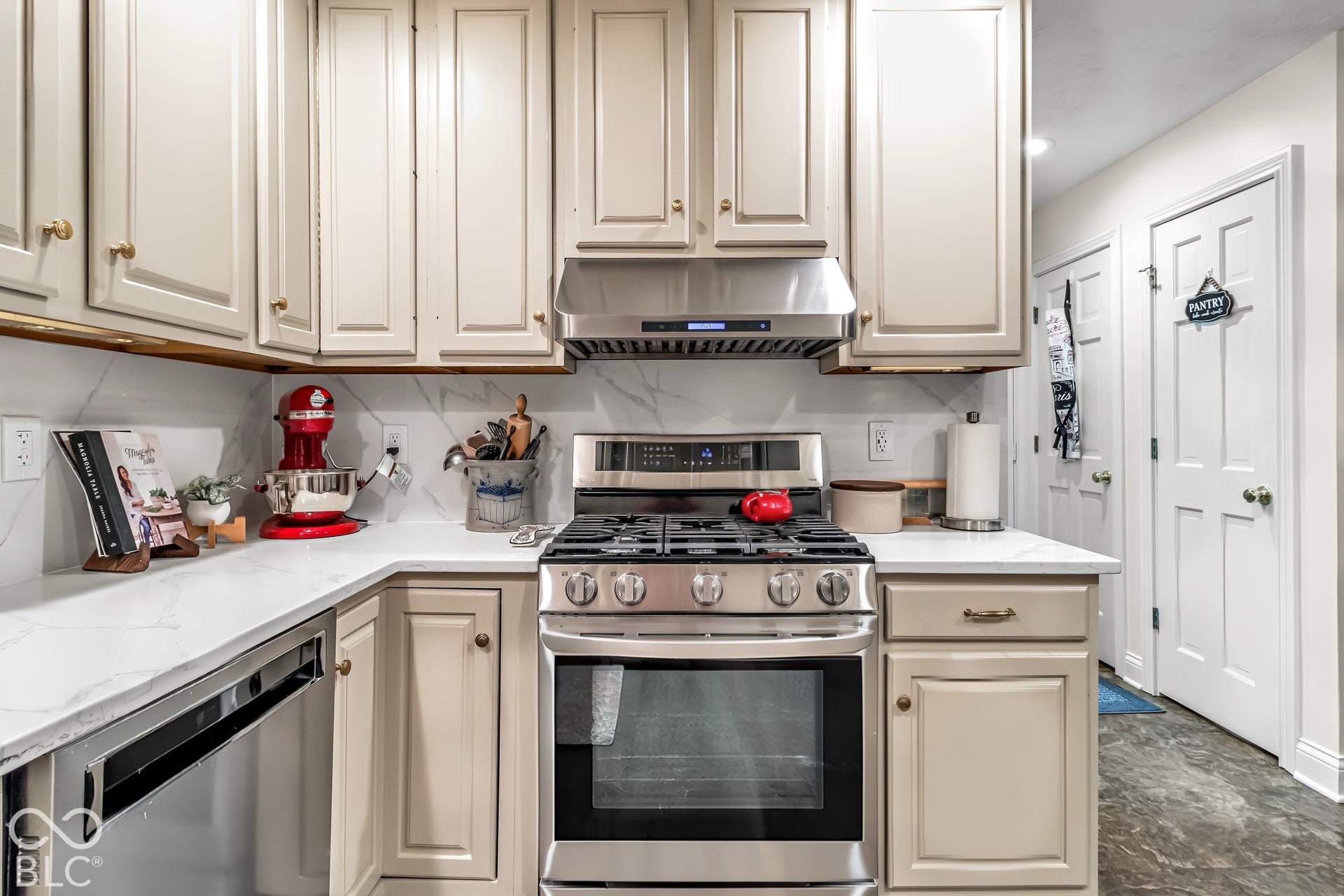 Kitchen with gas stove and range hood