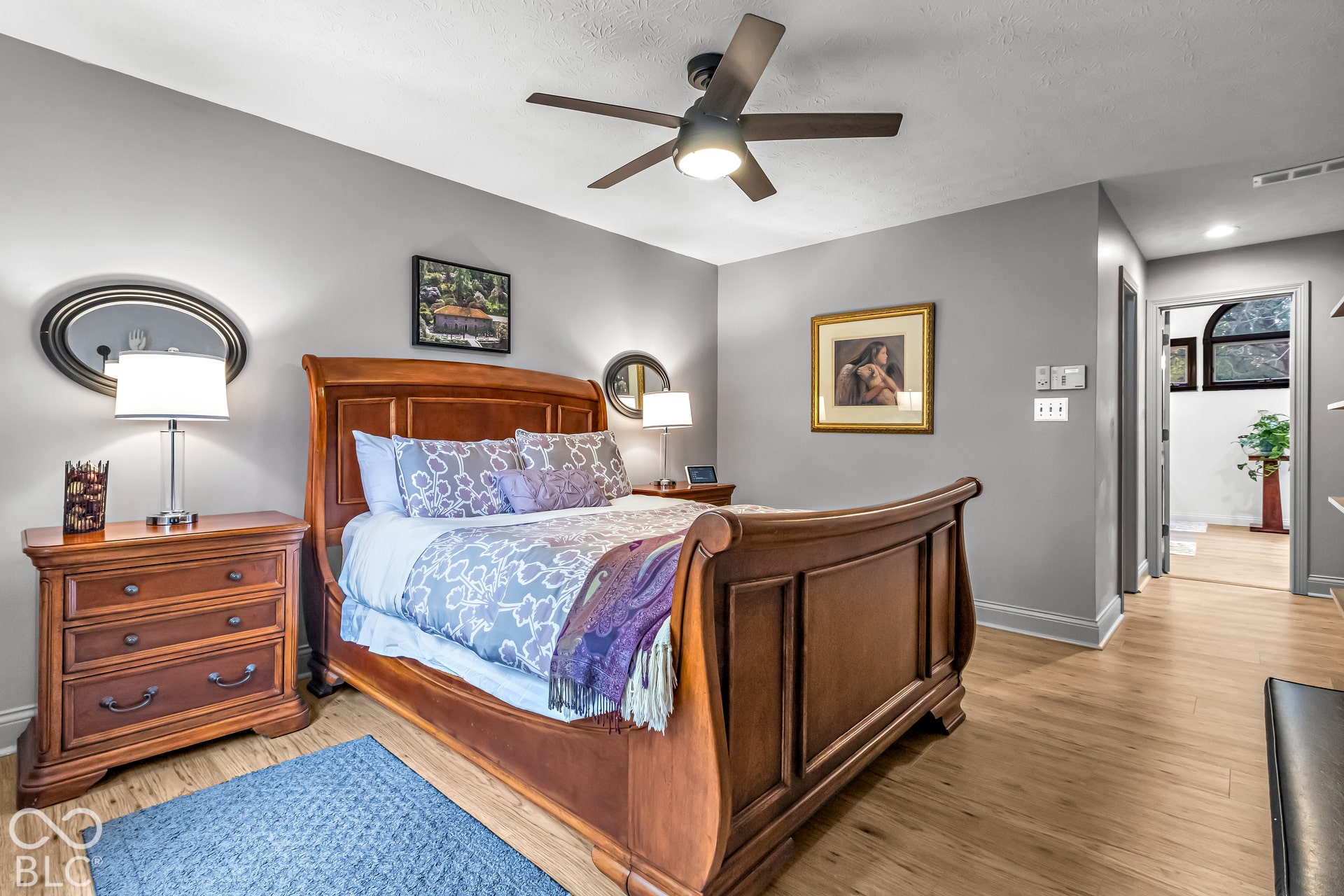 Primary bedroom with engineered flooring.