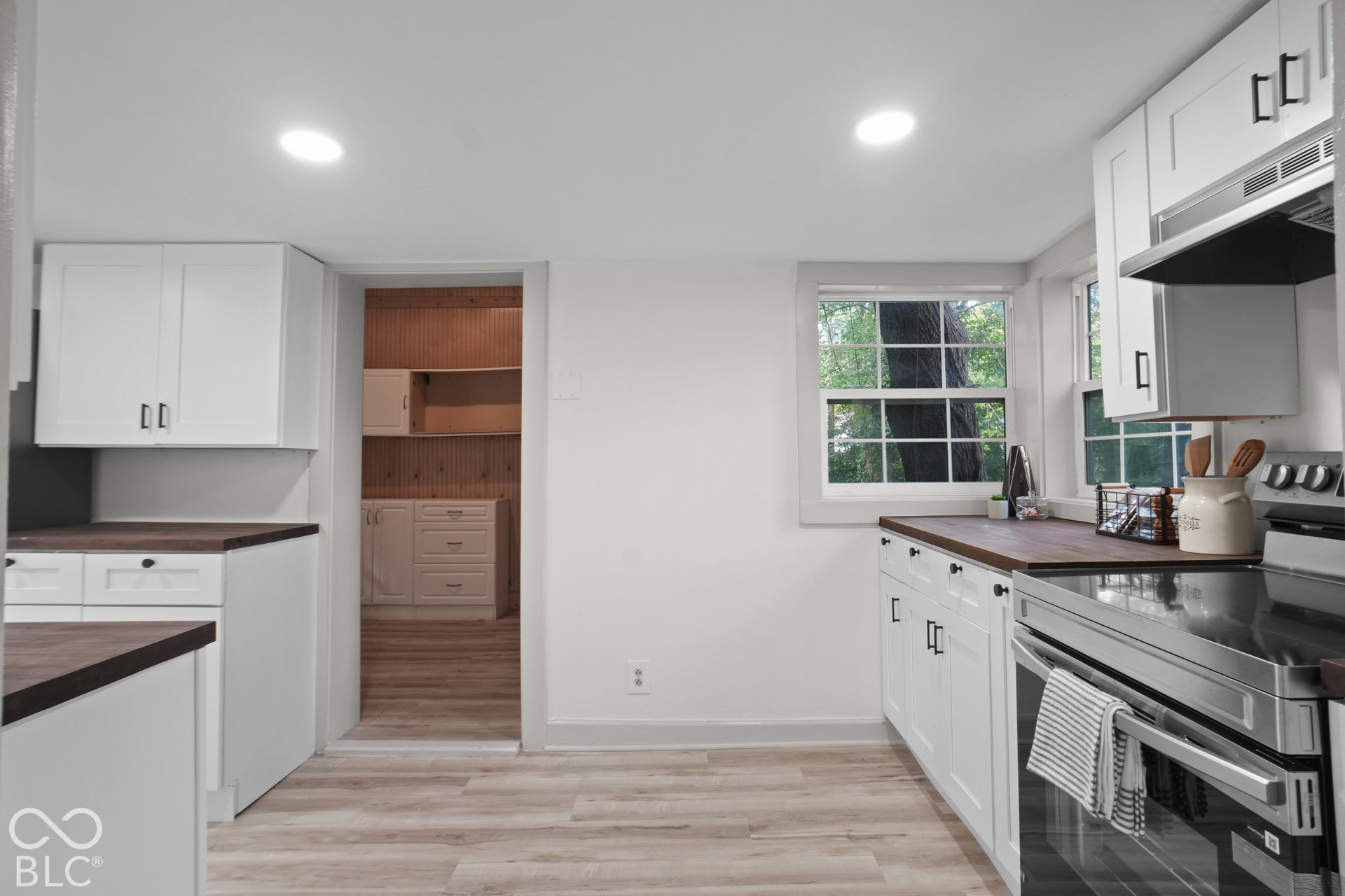 White shaker cabinetry with matte black hardware
