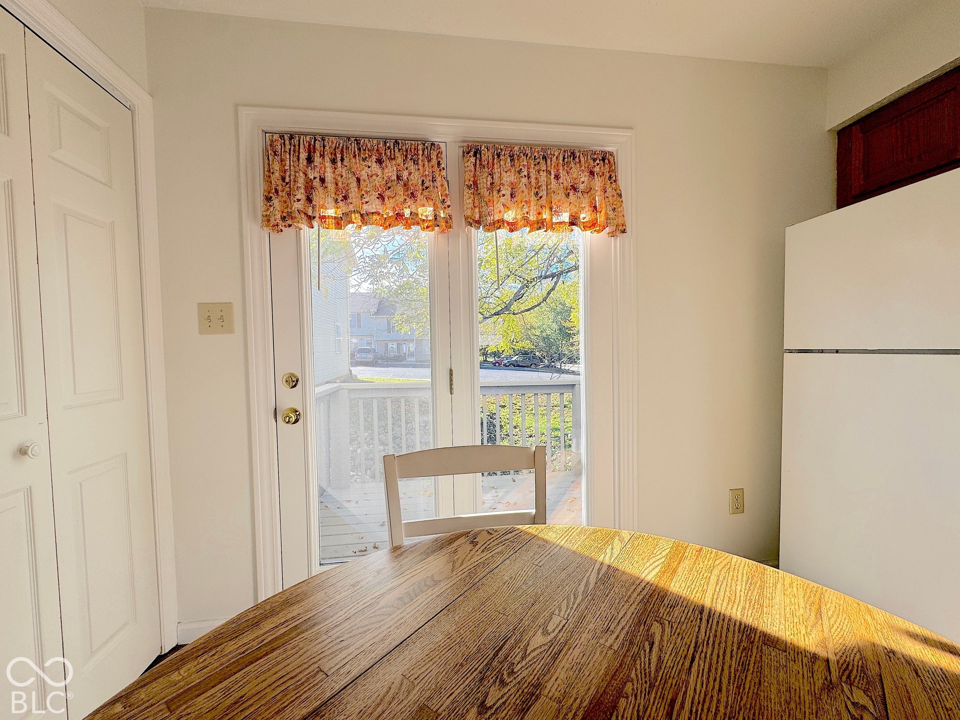 Patio door with side-by-side glass panels