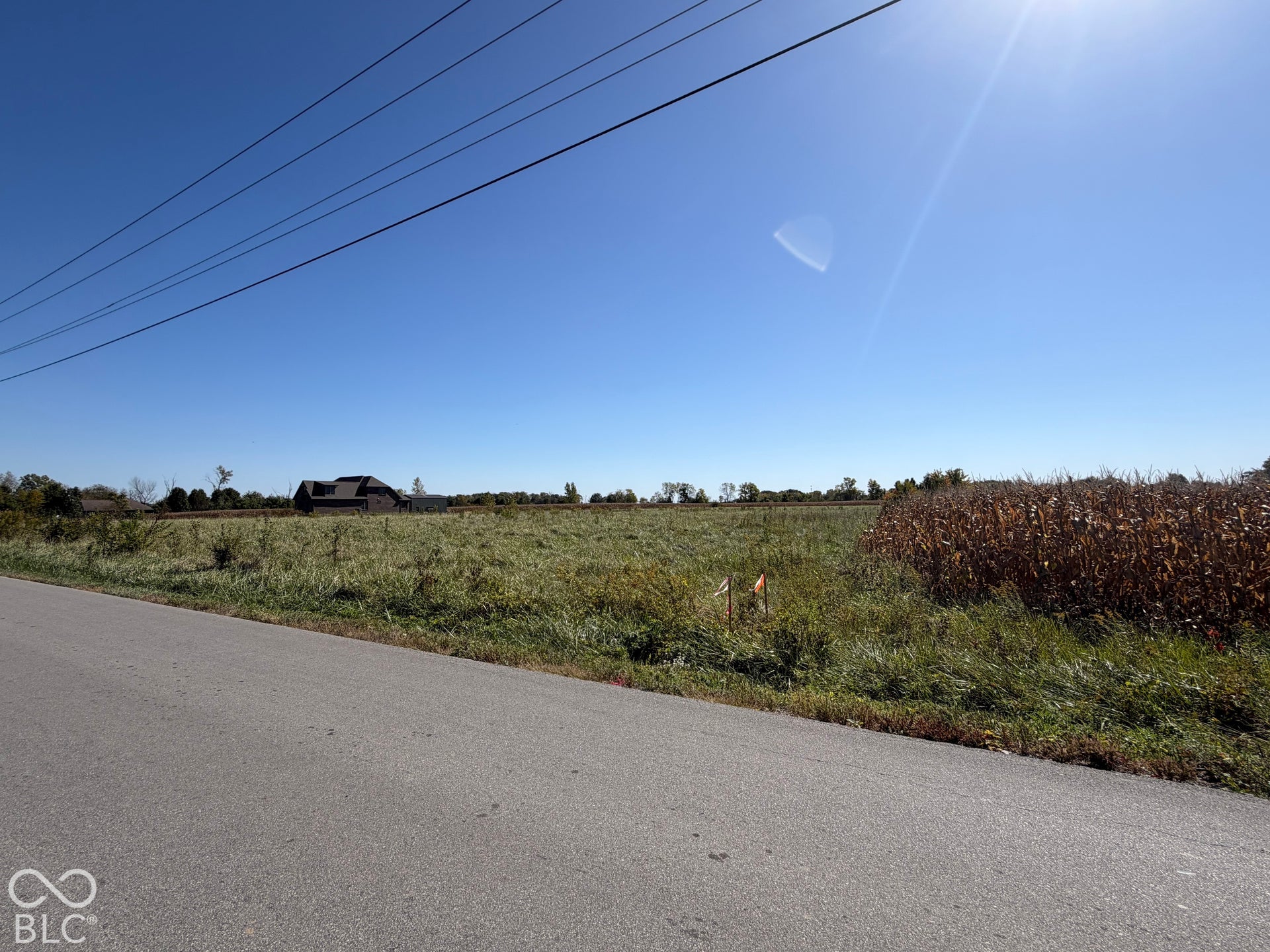 Right Angle from Front at North East Corner of Property - Showing Road and Overhead Wires