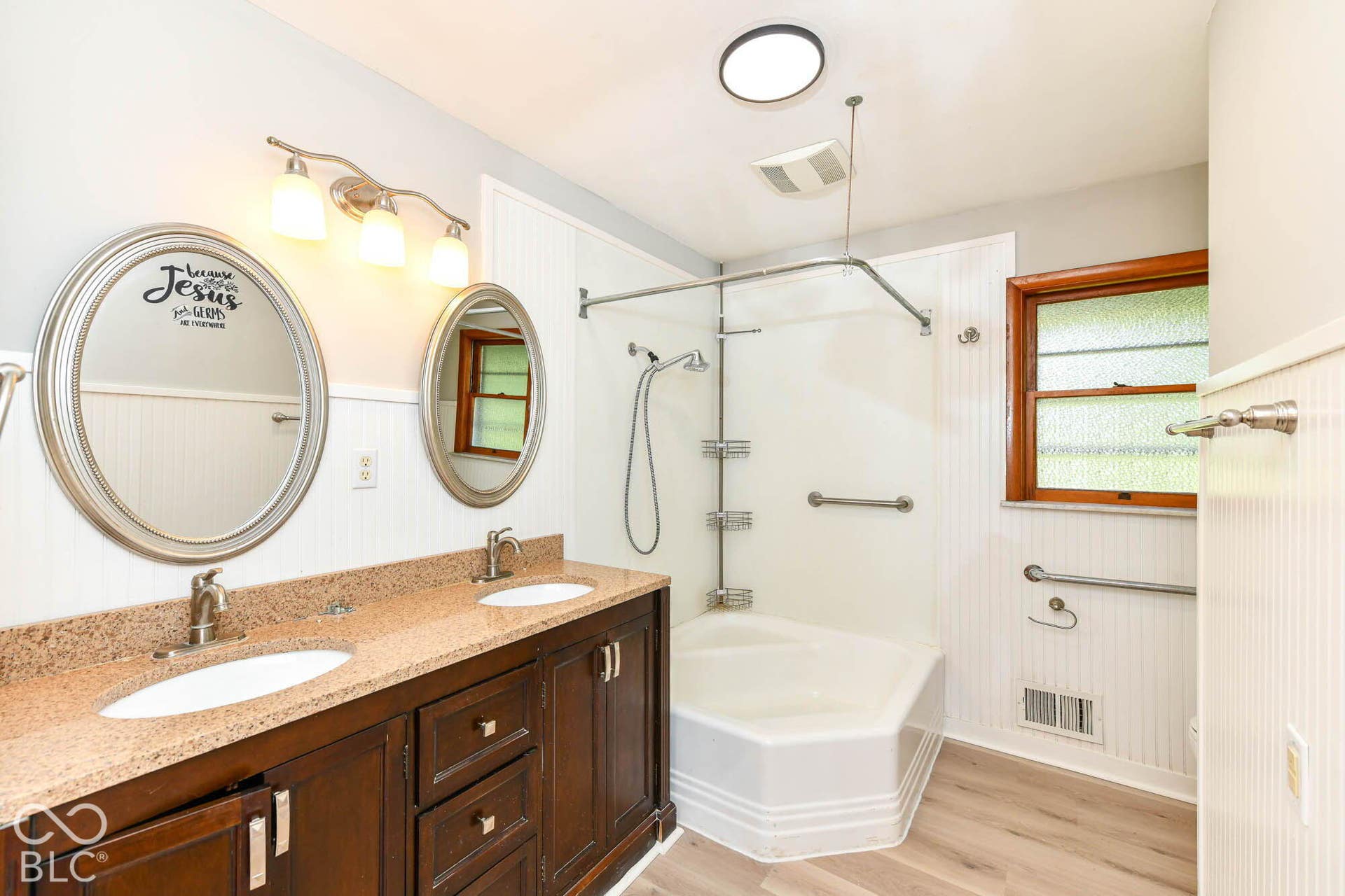 6401 Orinoco Avenue, Indianapolis, IN 46227 Dual vanity with undermount sinks, granite-look countertop, and wood-finish cabinetry