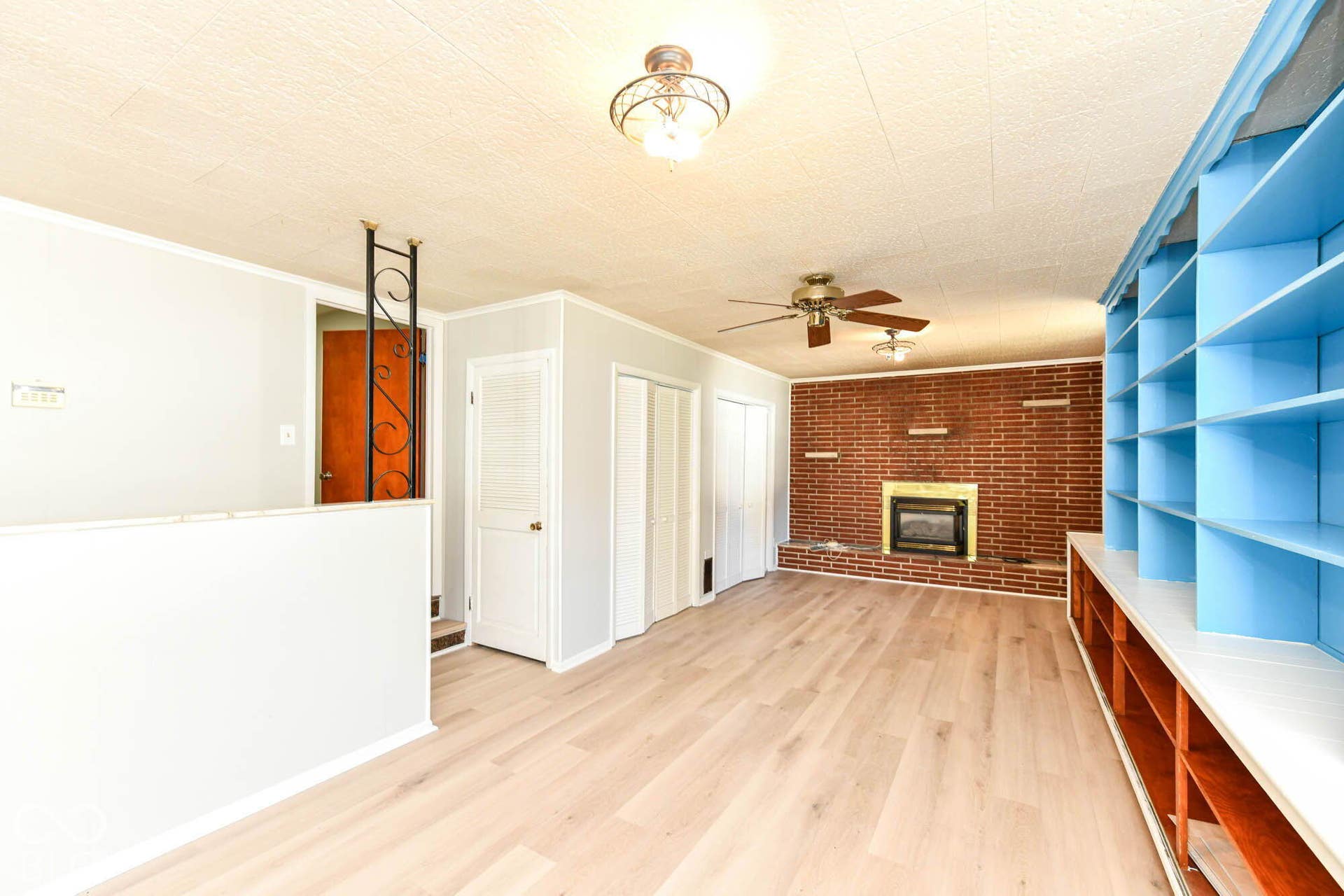 6401 Orinoco Avenue, Indianapolis, IN 46227 Warm brick fireplace with a gold-tone insert