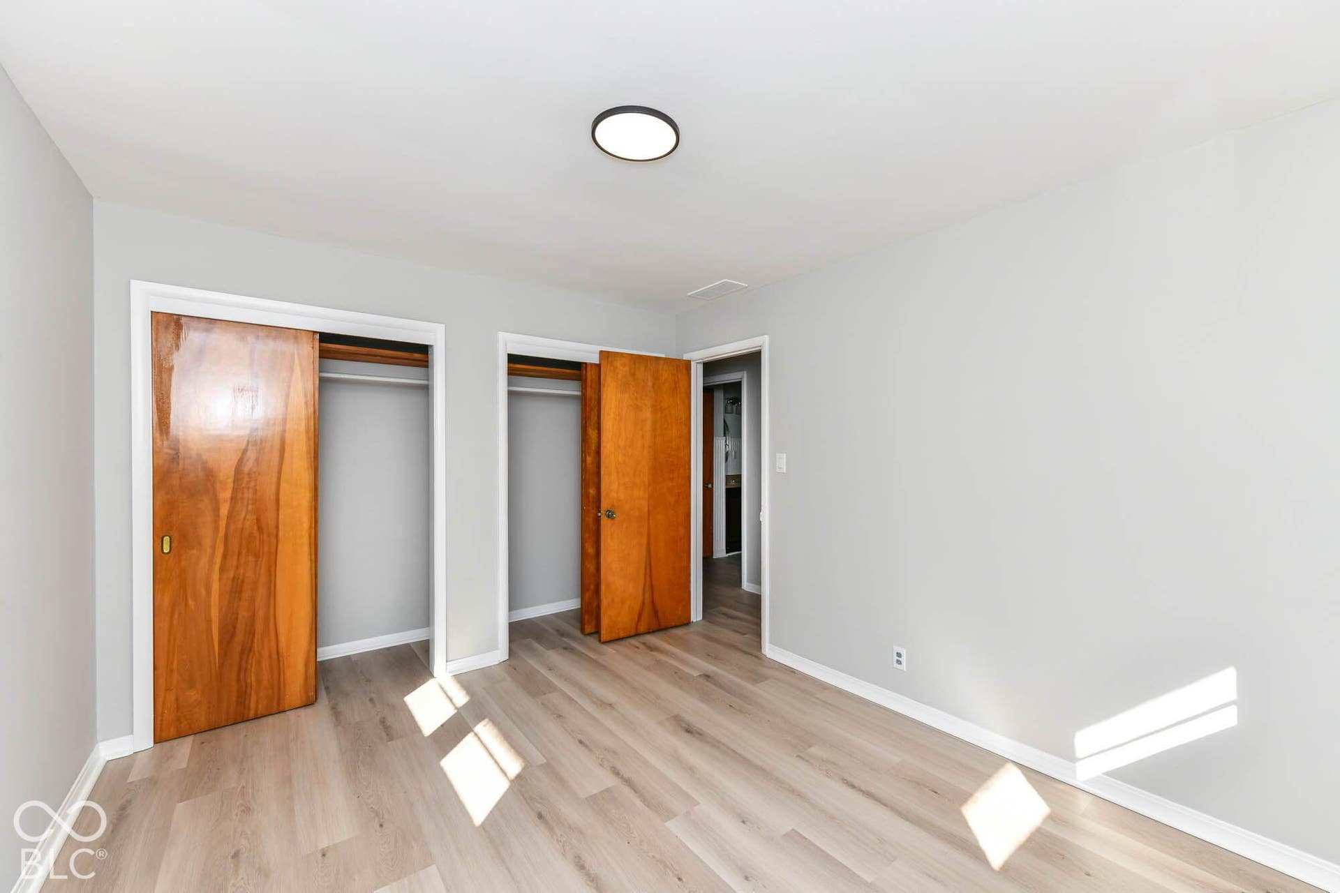 6401 Orinoco Avenue, Indianapolis, IN 46227 Light wood-finish flooring, two large closets with wood sliding doors, and a wood entry door