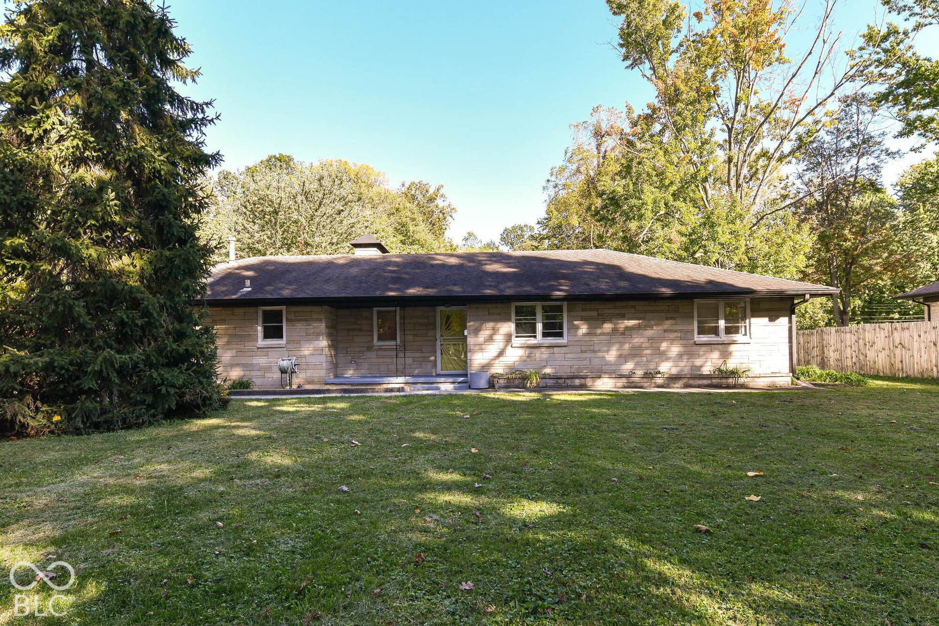 6401 Orinoco Avenue, Indianapolis, IN 46227 Single-story residence featuring a stone block exterior and a dark-toned roof