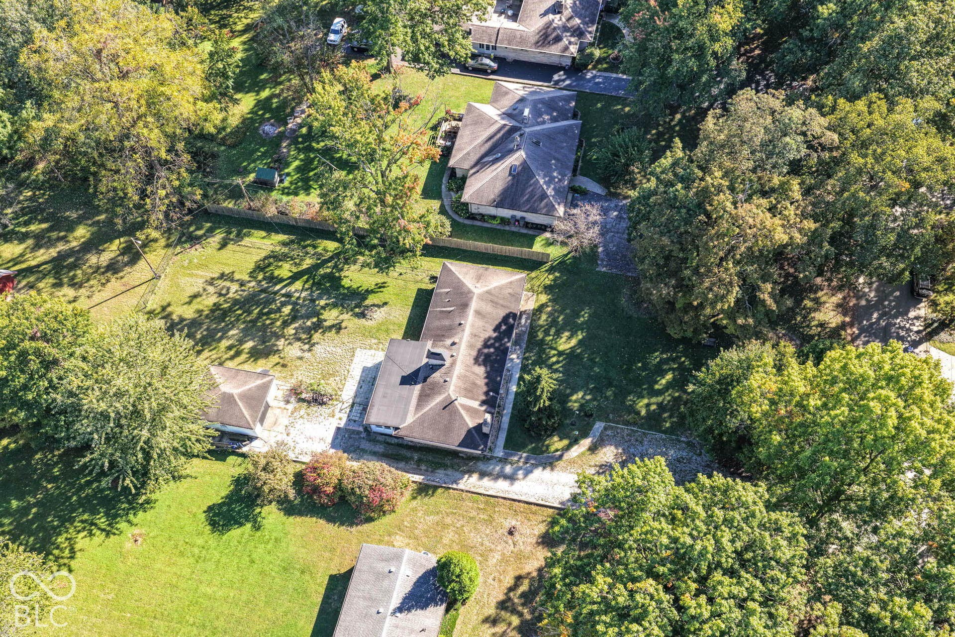 6401 Orinoco Avenue, Indianapolis, IN 46227 Mature trees and a spacious lot with lush green landscaping