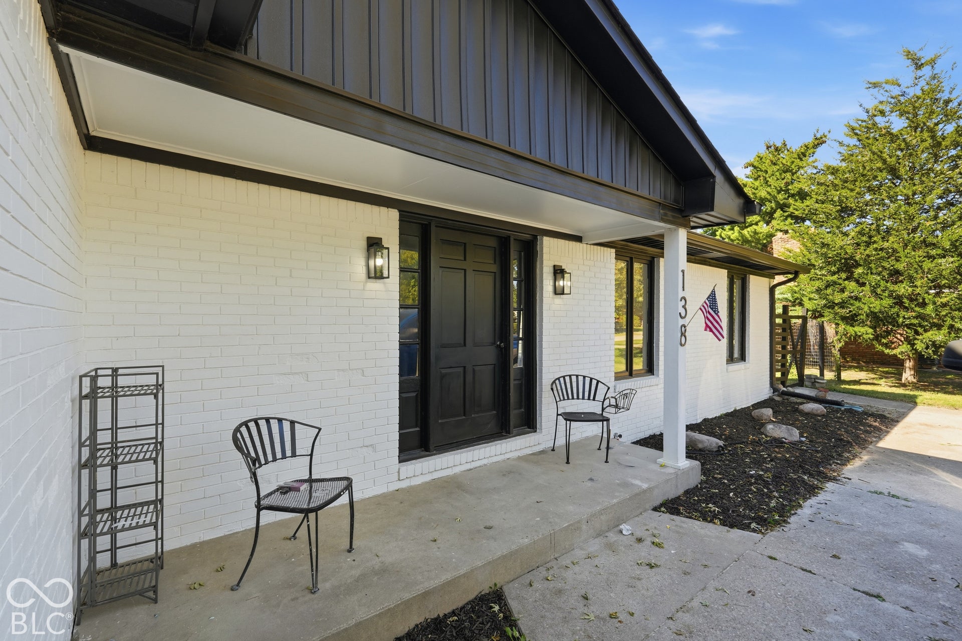 White brick exterior with black trim