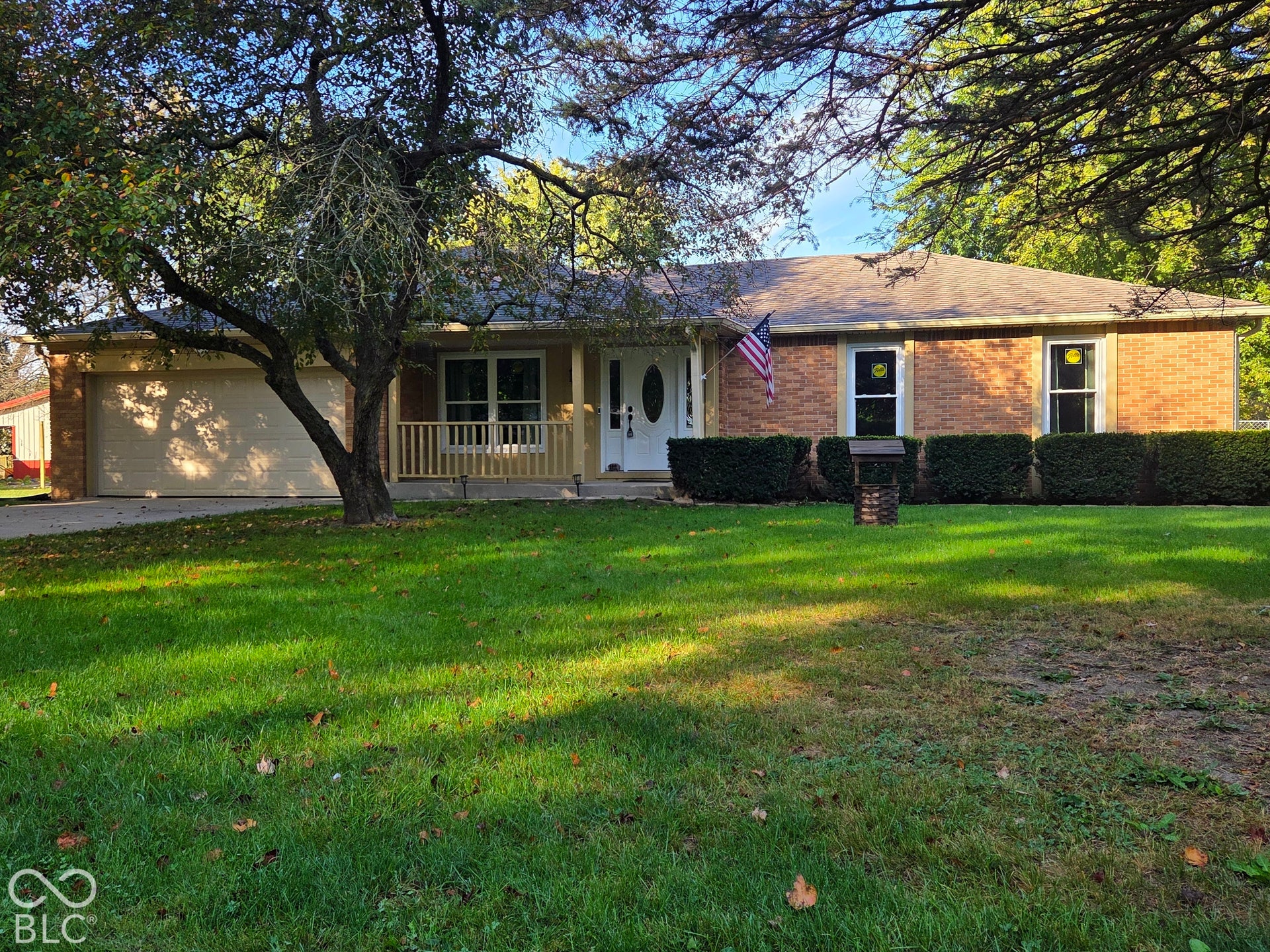6614 Weil Drive, Brownsburg, IN 46112 Brick exterior with a finished 2 car garage and a covered front porch.