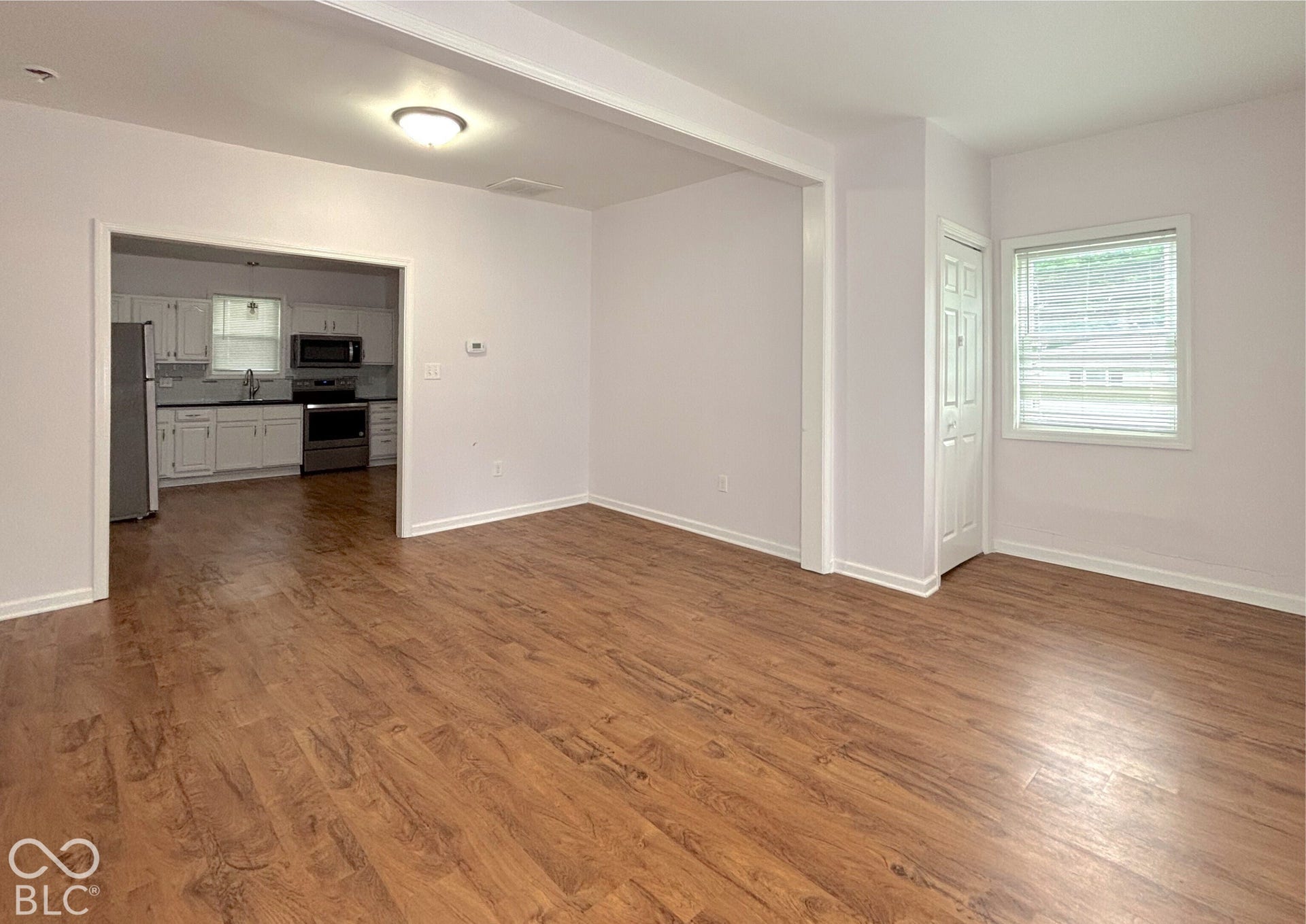 311 B Street S, Thorntown, IN 46071 Wood-finish flooring throughout, white interior walls, recessed lighting, and a kitchen with stainless steel appliances and white cabinetry