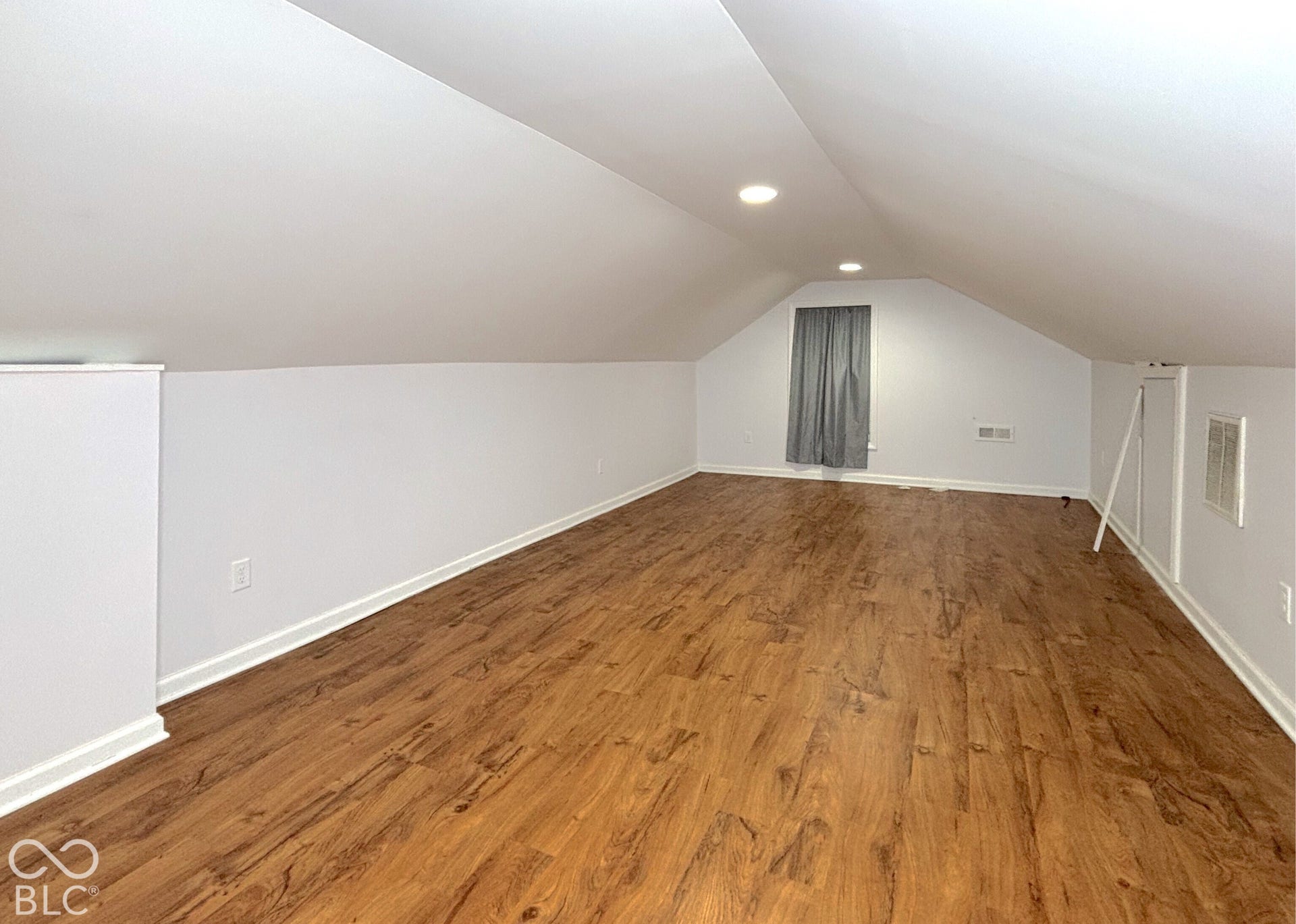 311 B Street S, Thorntown, IN 46071 Spacious room featuring wood-finish flooring, recessed lighting, and sloped ceilings