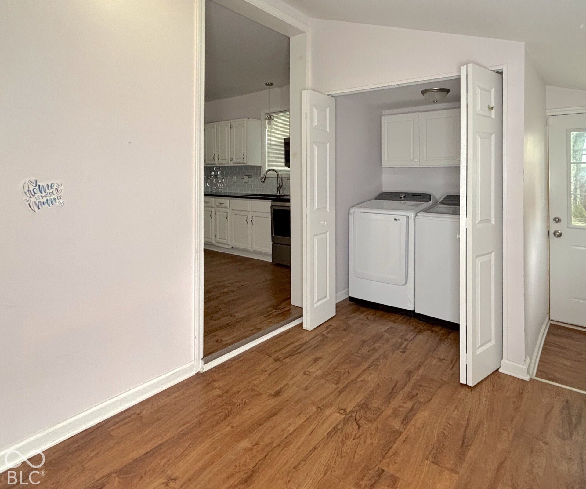 311 B Street S, Thorntown, IN 46071 Wood-finish flooring throughout, bright white walls, and a convenient laundry closet with storage cabinetry