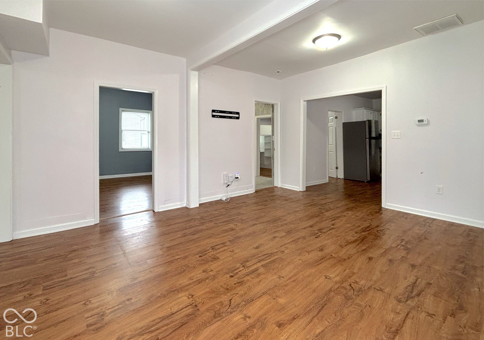 311 B Street S, Thorntown, IN 46071 Wood-finish flooring throughout, white painted walls, and overhead flush-mount lighting