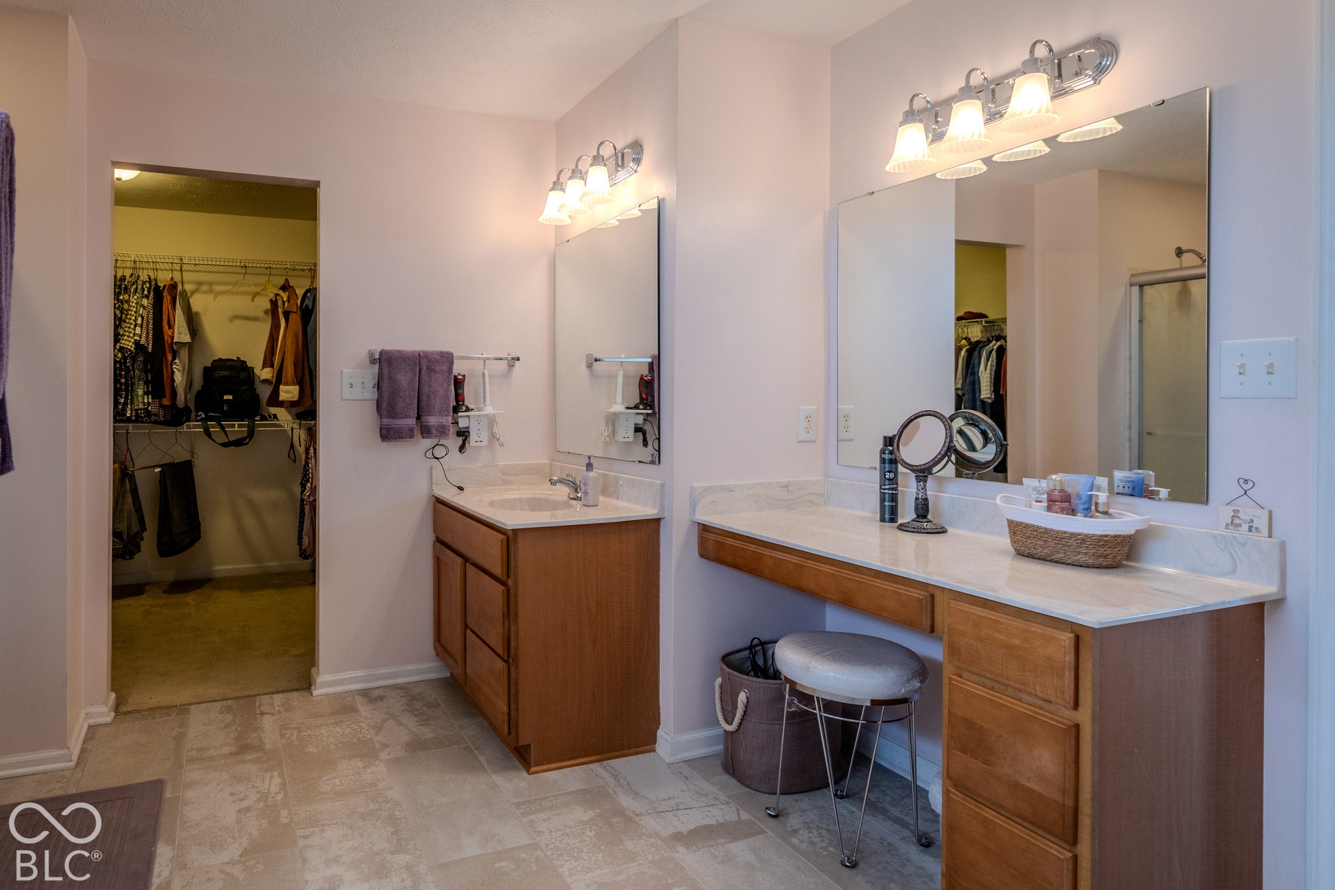 12046 Cowboys, Fishers, IN 46037 Dual vanities with a make up table set this bath apart from many others. It is spacious and offers a calming respite at the end of a busy day.