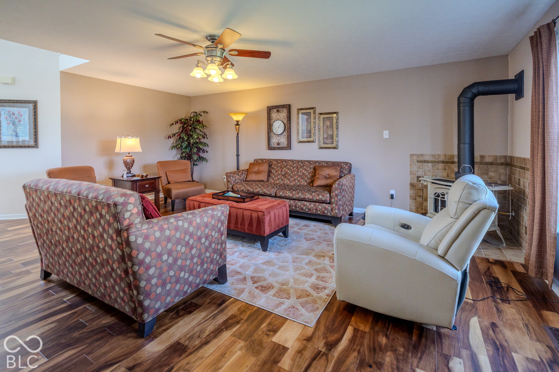 12046 Cowboys, Fishers, IN 46037 The ceiling fan keeps air circulating in the summer time and the gleaming wood floors give a quality feeling to the room.