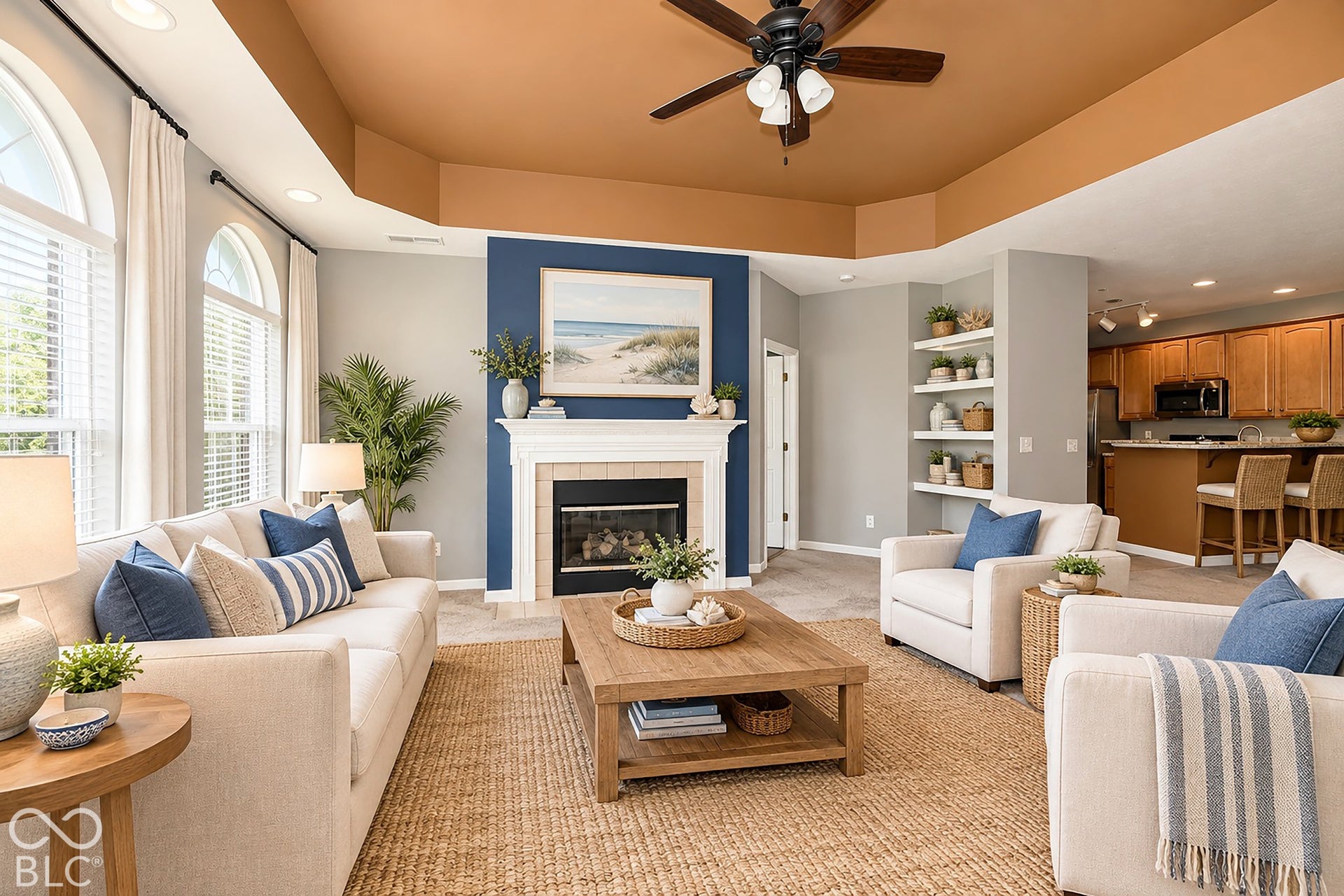 6673 Avila Way, Fishers, IN 46038 Virtually Altered - Arched windows, recessed lighting, and a prominent fireplace with a white mantel and hearth