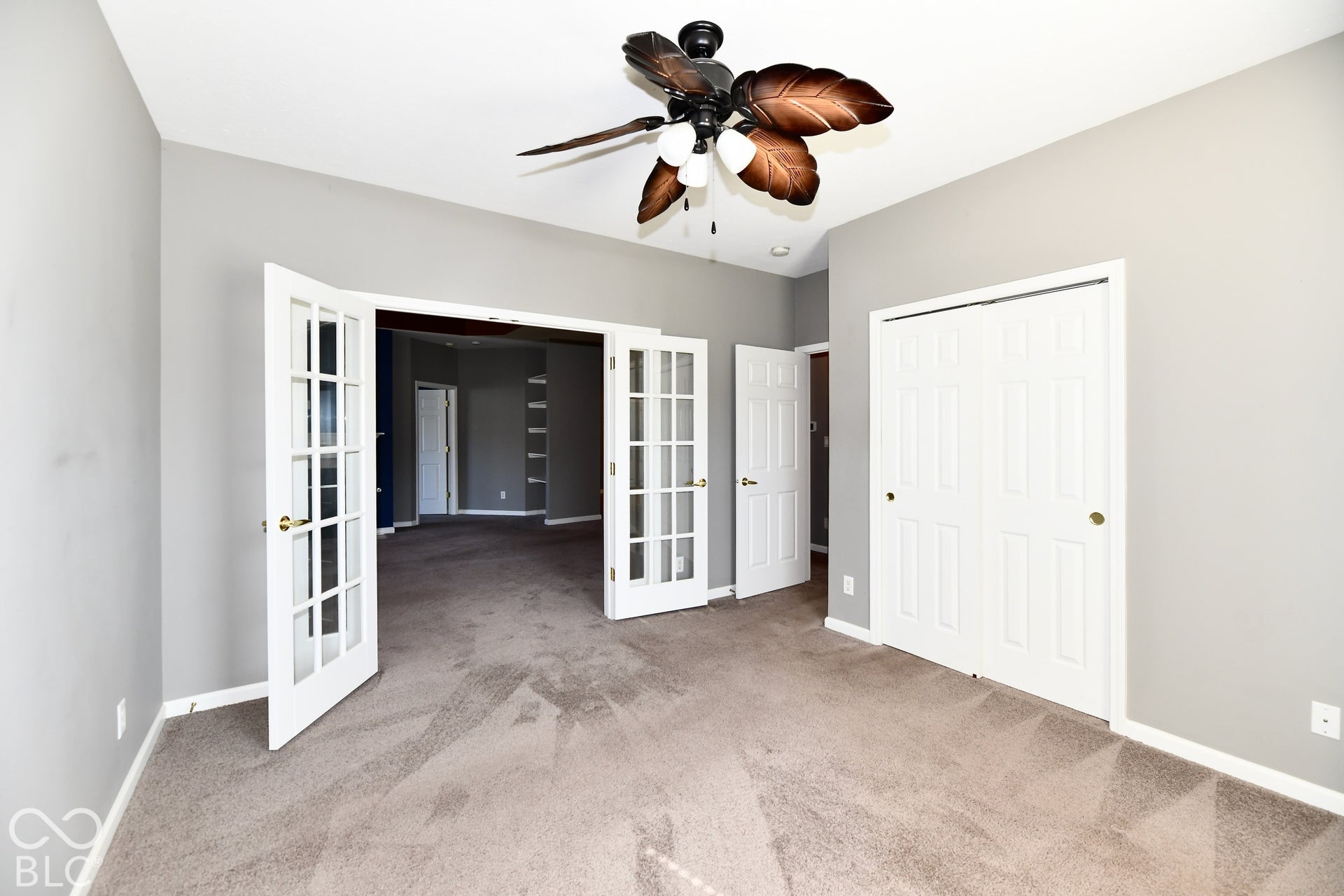 6673 Avila Way, Fishers, IN 46038 Recessed ceiling, ceiling fan with light fixture, carpet flooring, double panel closet doors, and French doors with glass panes